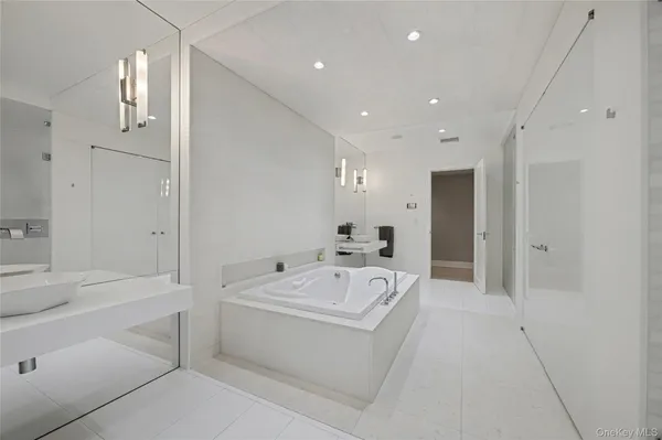 a living room with furniture a flat screen tv and a window