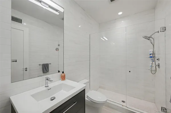 a bedroom with a bed and a chair