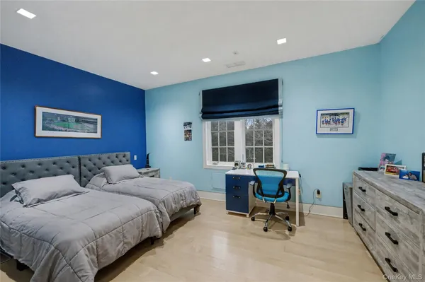 a bedroom with a bed and a couch