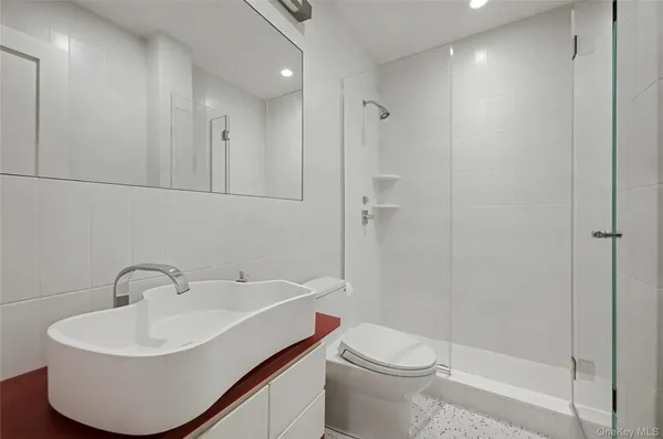 a kitchen with stainless steel appliances granite countertop a refrigerator and a stove