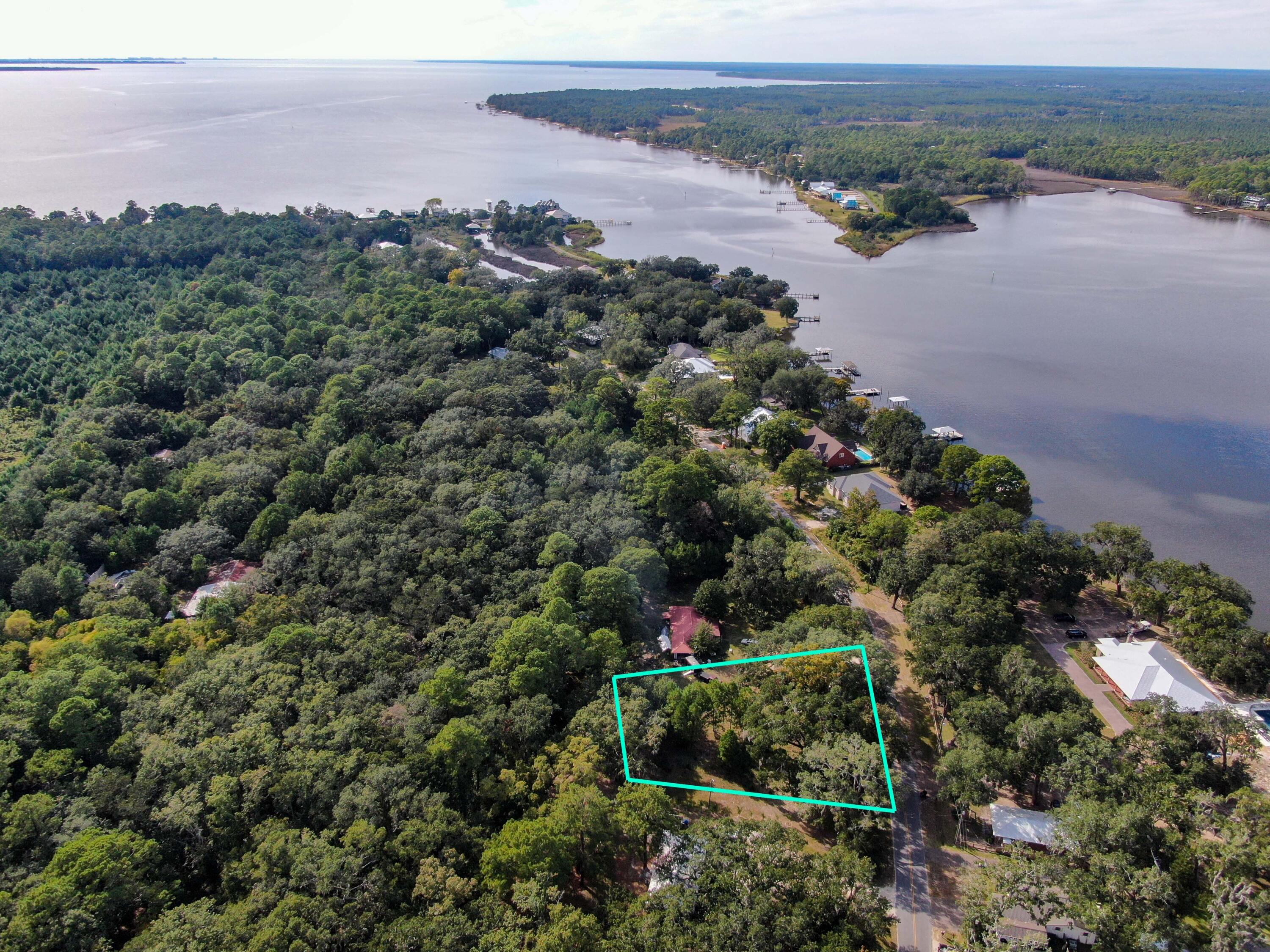 Xxx Bay Grove Road Freeport, FL 32439 - Photo 5 of 10 an aerial view of a houses with a yard and mountain view in back