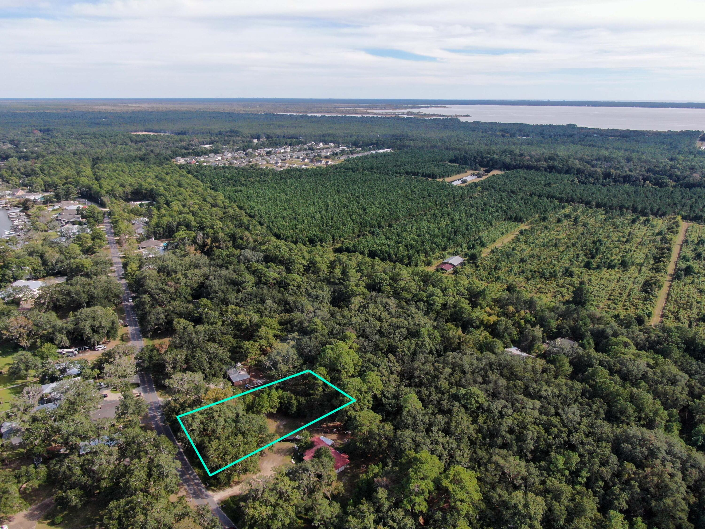 Xxx Bay Grove Road Freeport, FL 32439 - Photo 8 of 10 an aerial view of a residential houses with outdoor space and trees