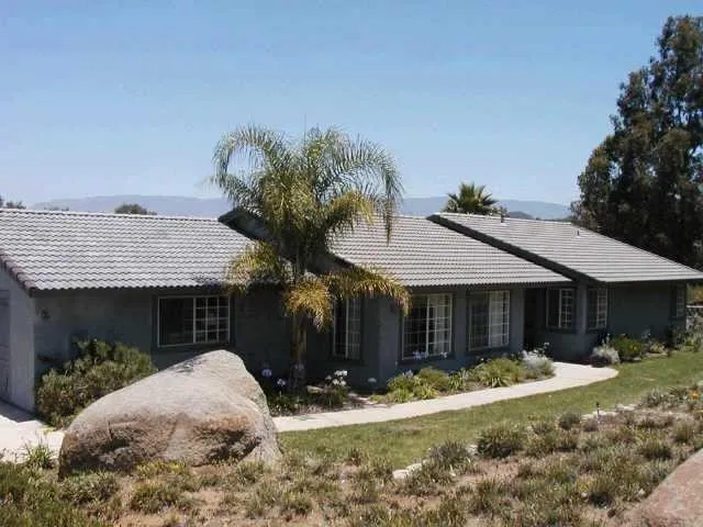 13848 Misty Oak Road Valley Center, CA 92082 - Photo 1 of 1 a front view of a house with a yard and garage