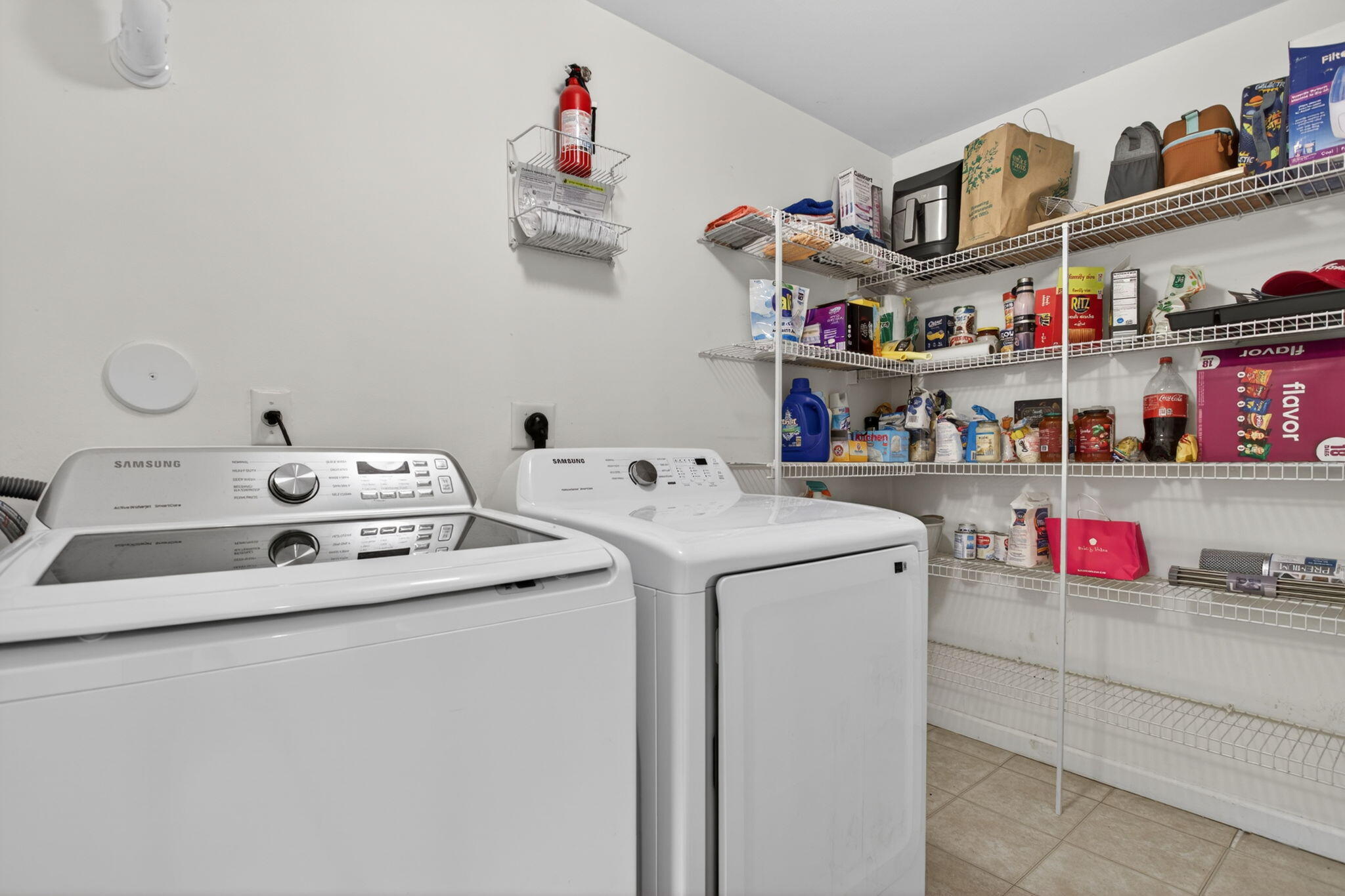5880 West Sample Road, Unit 206 Coral Springs, FL 33067 - Photo 21 of 37 a utility room with dryer washer and shoe rack