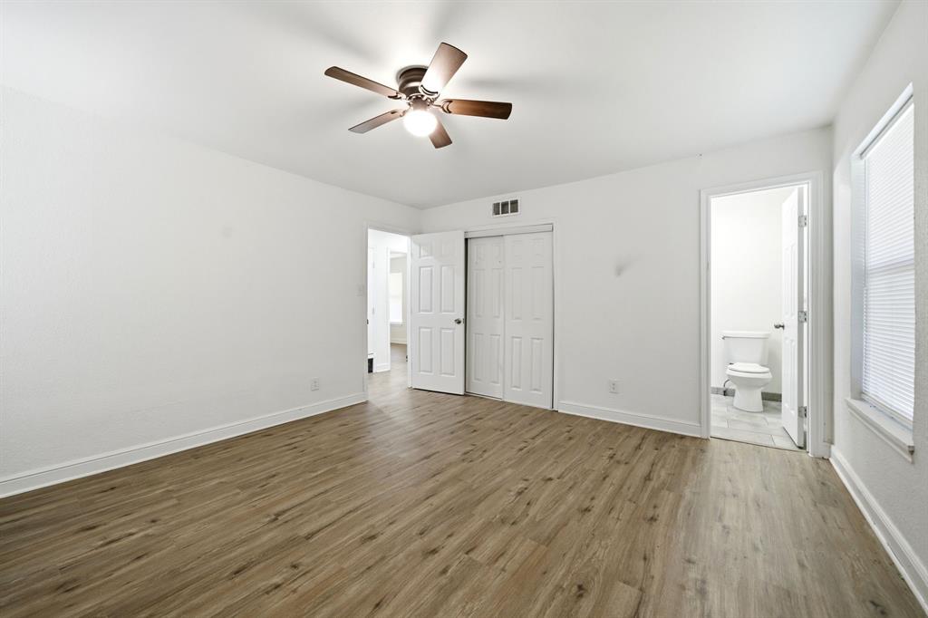 619 9th Street Terrell, TX 75160 - Photo 14 of 24 wooden floor in an empty room with a window