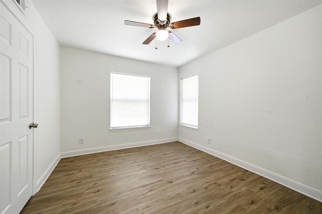 619 9th Street Terrell, TX 75160 - Photo 16 of 24 wooden floor in an empty room with a window