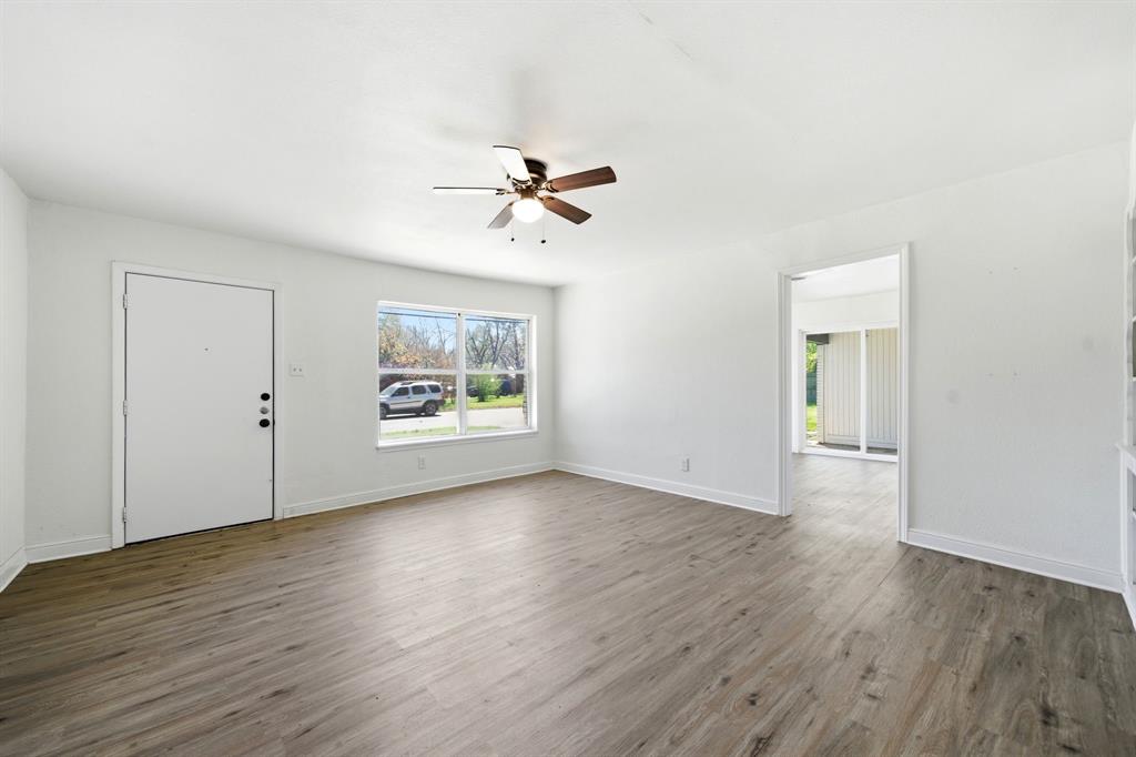619 9th Street Terrell, TX 75160 - Photo 19 of 24 wooden floor in an empty room with a window