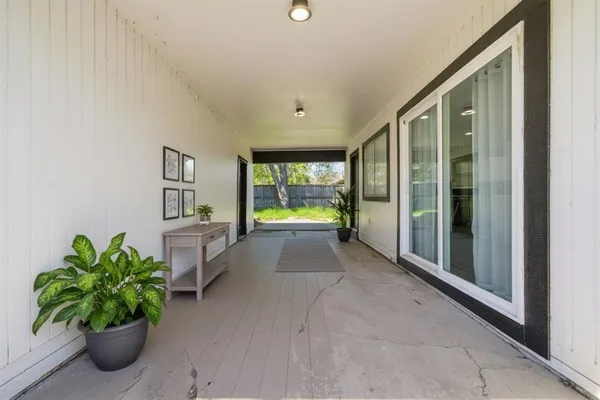 a lobby with furniture and a potted plant