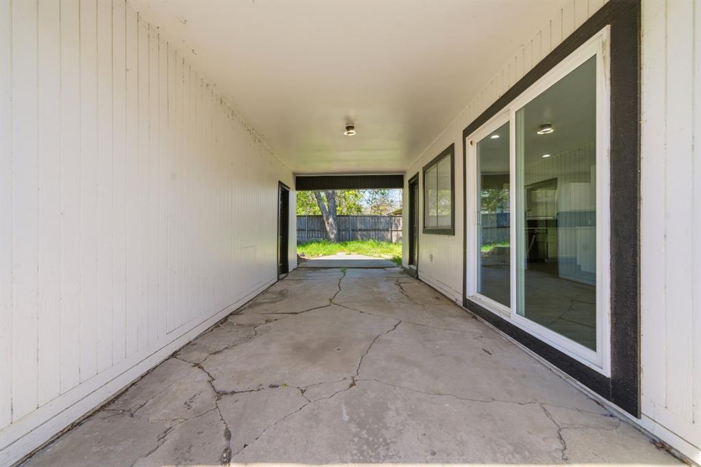619 9th Street Terrell, TX 75160 - Photo 21 of 24 a view of an empty room with glass door
