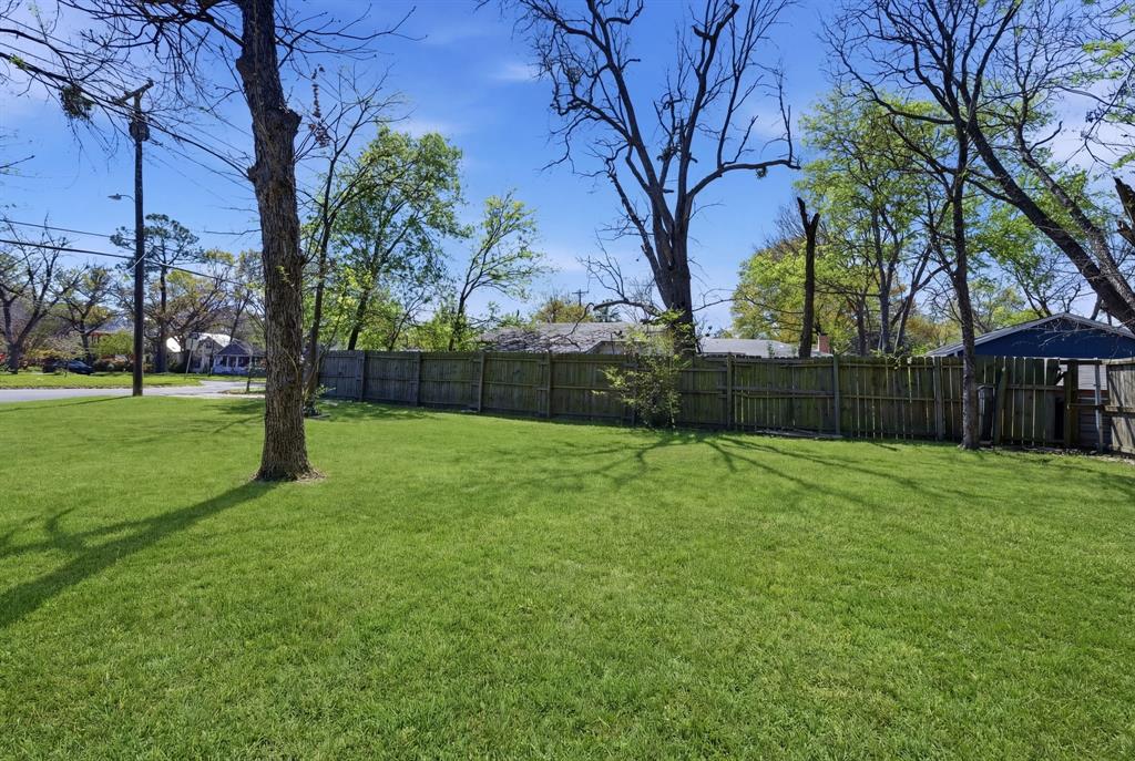 619 9th Street Terrell, TX 75160 - Photo 22 of 24 a backyard of a house with lots of green space