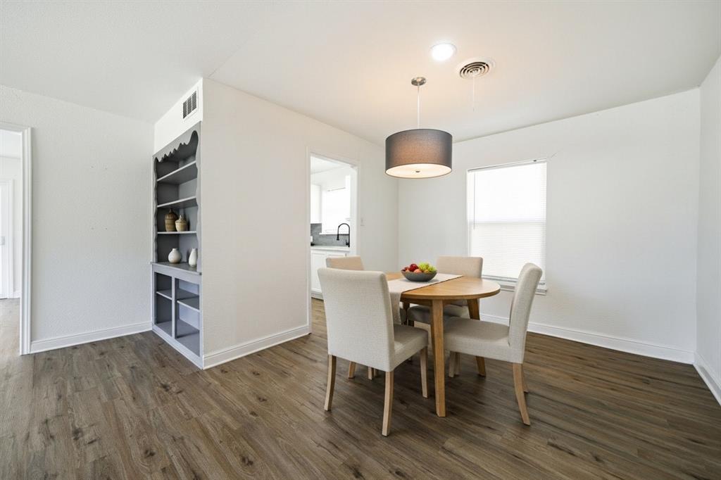619 9th Street Terrell, TX 75160 - Photo 5 of 24 a view of a dining room with furniture and wooden floor