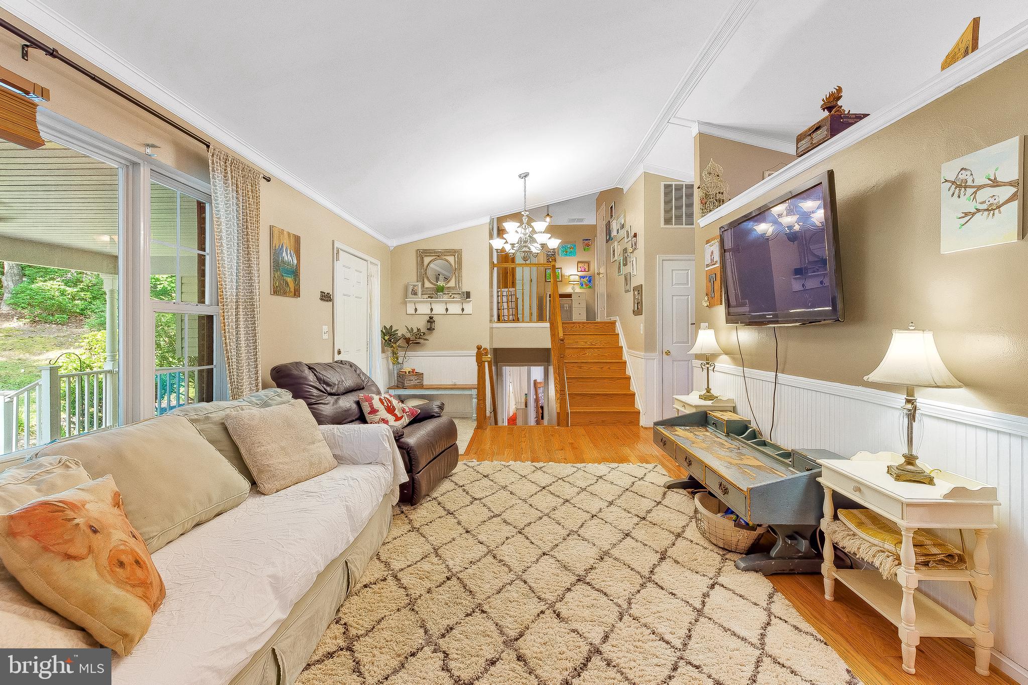 11356 Redlands Road Lusby, MD 20657 - Photo 10 of 36 a living room with furniture and a lamp