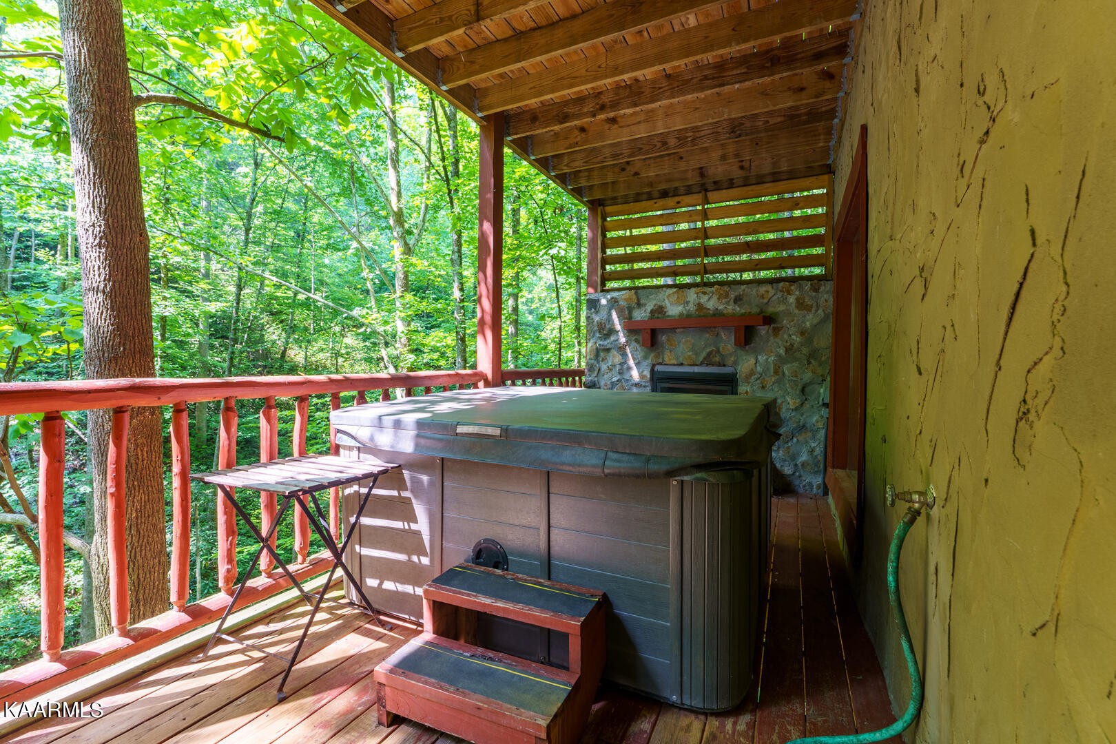219 Edens Way Sevierville, TN 37876 - Photo 21 of 29 a view of balcony with wooden floor outdoor seating and yard in back