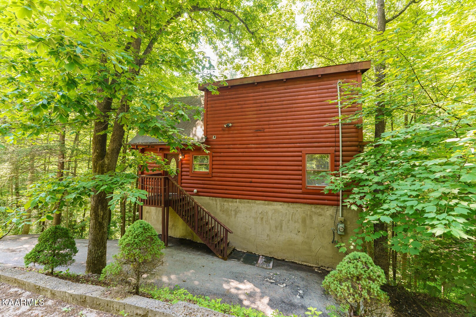 219 Edens Way Sevierville, TN 37876 - Photo 29 of 29 a yellow house with trees in front of it