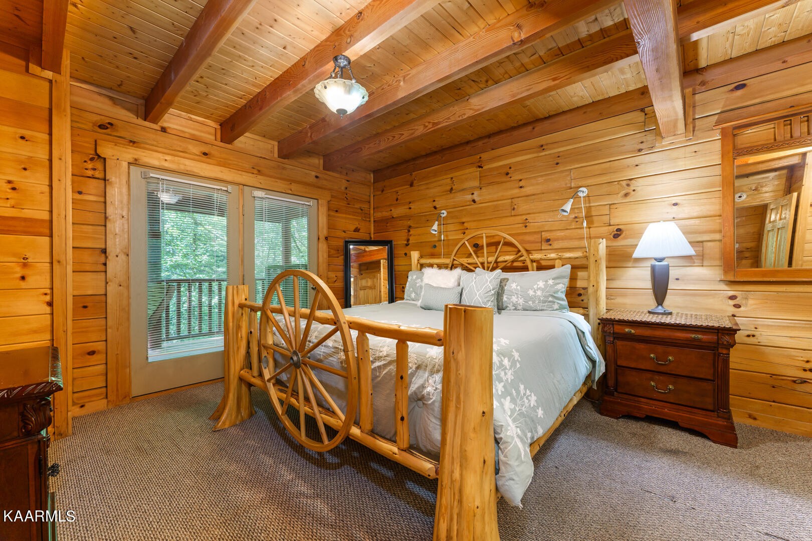 219 Edens Way Sevierville, TN 37876 - Photo 7 of 29 a bed sitting in a room next to a balcony