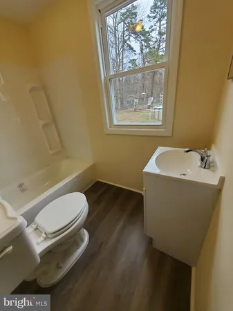 a bathroom with a toilet and a sink