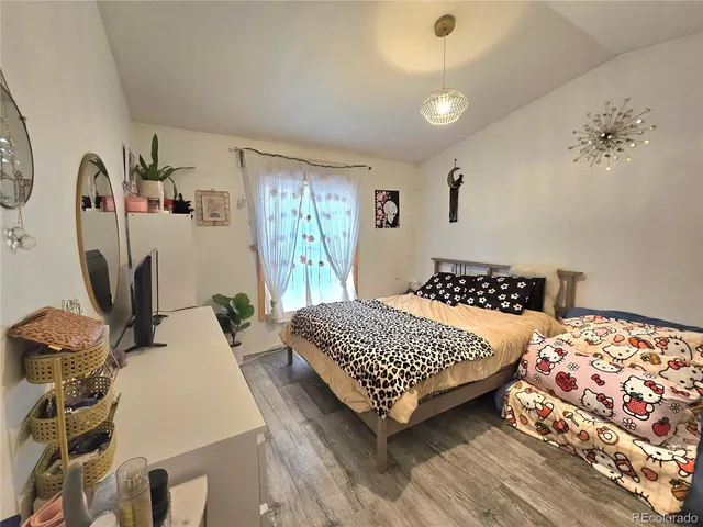 a bedroom with two beds and a dresser
