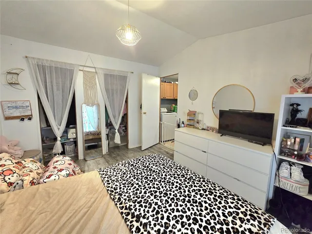 a bed room with a bed and a cabinets