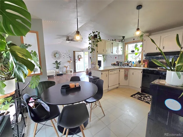 a kitchen with a table and chairs in it