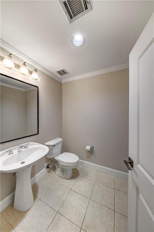 2626 Peachtree Road Northwest, Unit 412 Atlanta, GA 30305 - Photo 18 of 38 a bathroom with a toilet sink and mirror