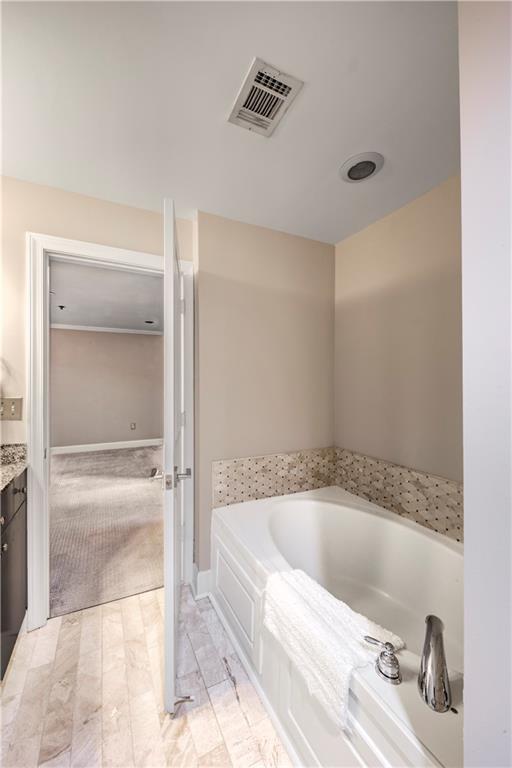 2626 Peachtree Road Northwest, Unit 412 Atlanta, GA 30305 - Photo 23 of 38 a bathroom with a tub and shower