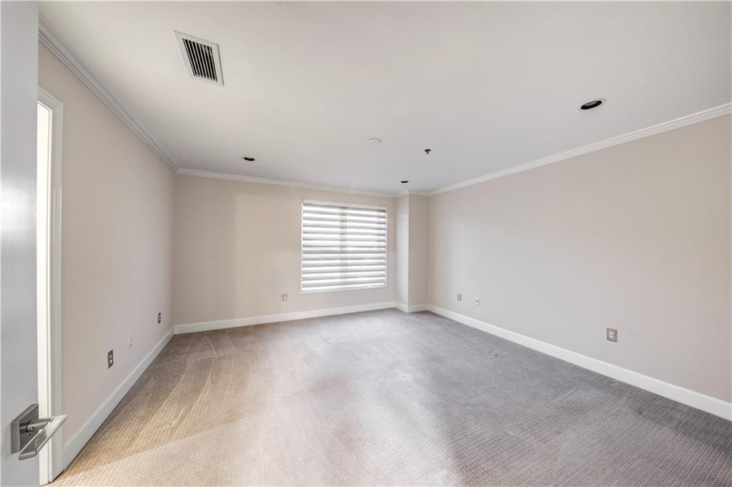 2626 Peachtree Road Northwest, Unit 412 Atlanta, GA 30305 - Photo 27 of 38 a view of an empty room with a window