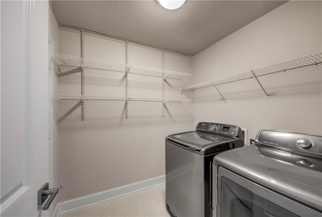 2626 Peachtree Road Northwest, Unit 412 Atlanta, GA 30305 - Photo 31 of 38 a utility room with dryer washer and empty racks