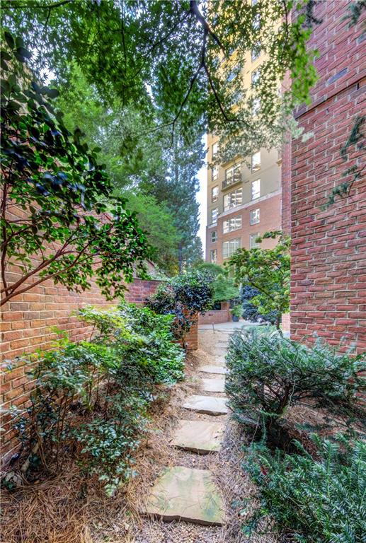 2626 Peachtree Road Northwest, Unit 412 Atlanta, GA 30305 - Photo 38 of 38 a backyard of a house with lots of green space and lake view