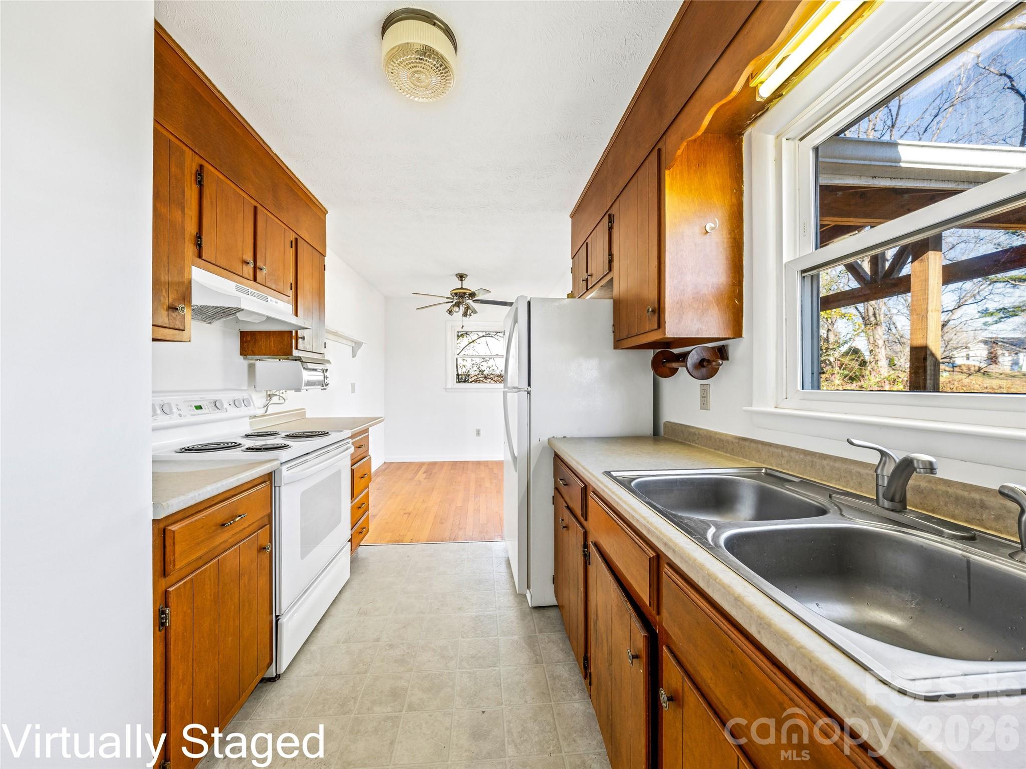 10 Ridge Avenue Asheville, NC 28803 - Photo 13 of 33 a kitchen with stainless steel appliances granite countertop a sink and a stove