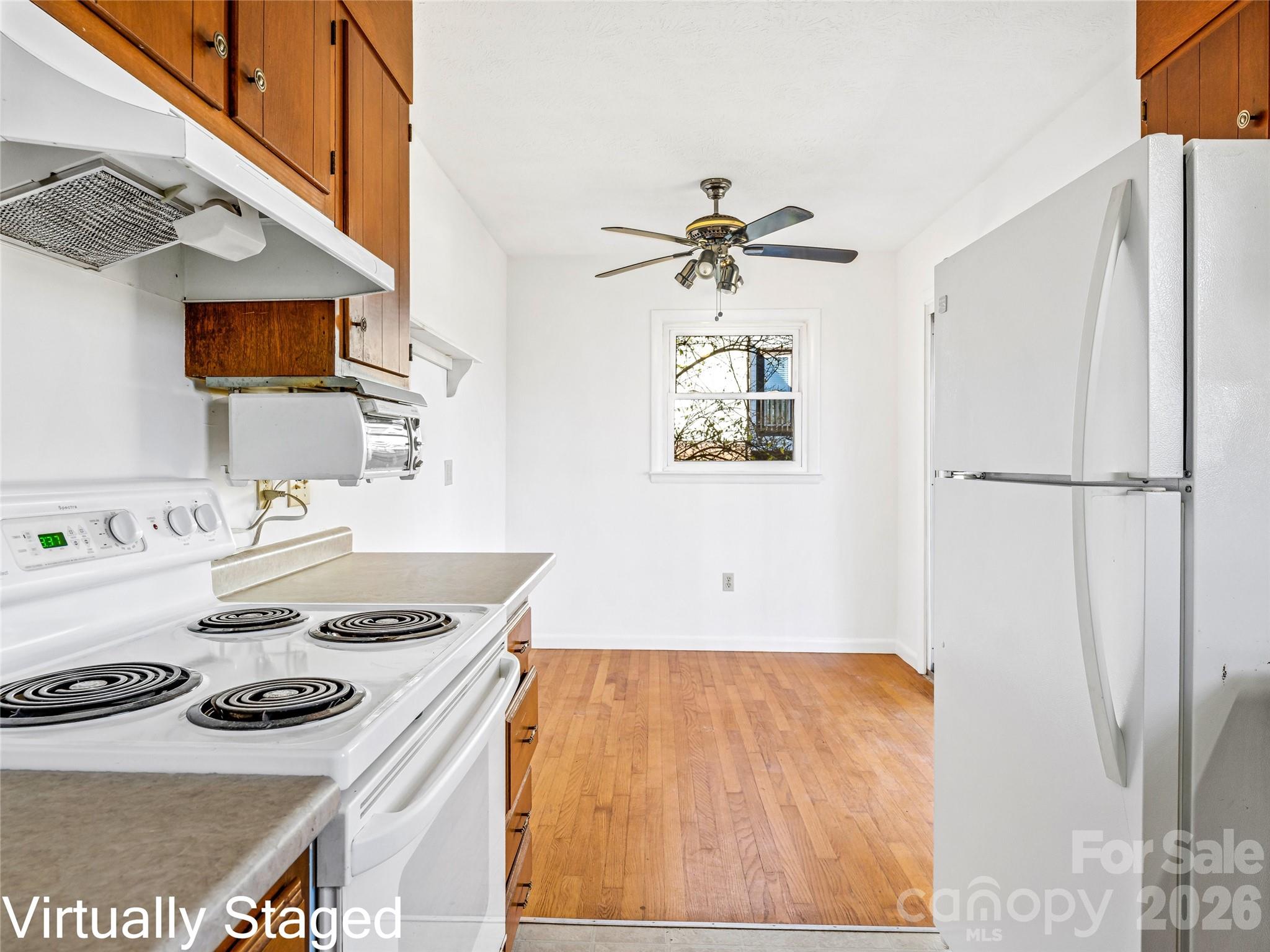 10 Ridge Avenue Asheville, NC 28803 - Photo 14 of 33 a kitchen with a stove and a refrigerator