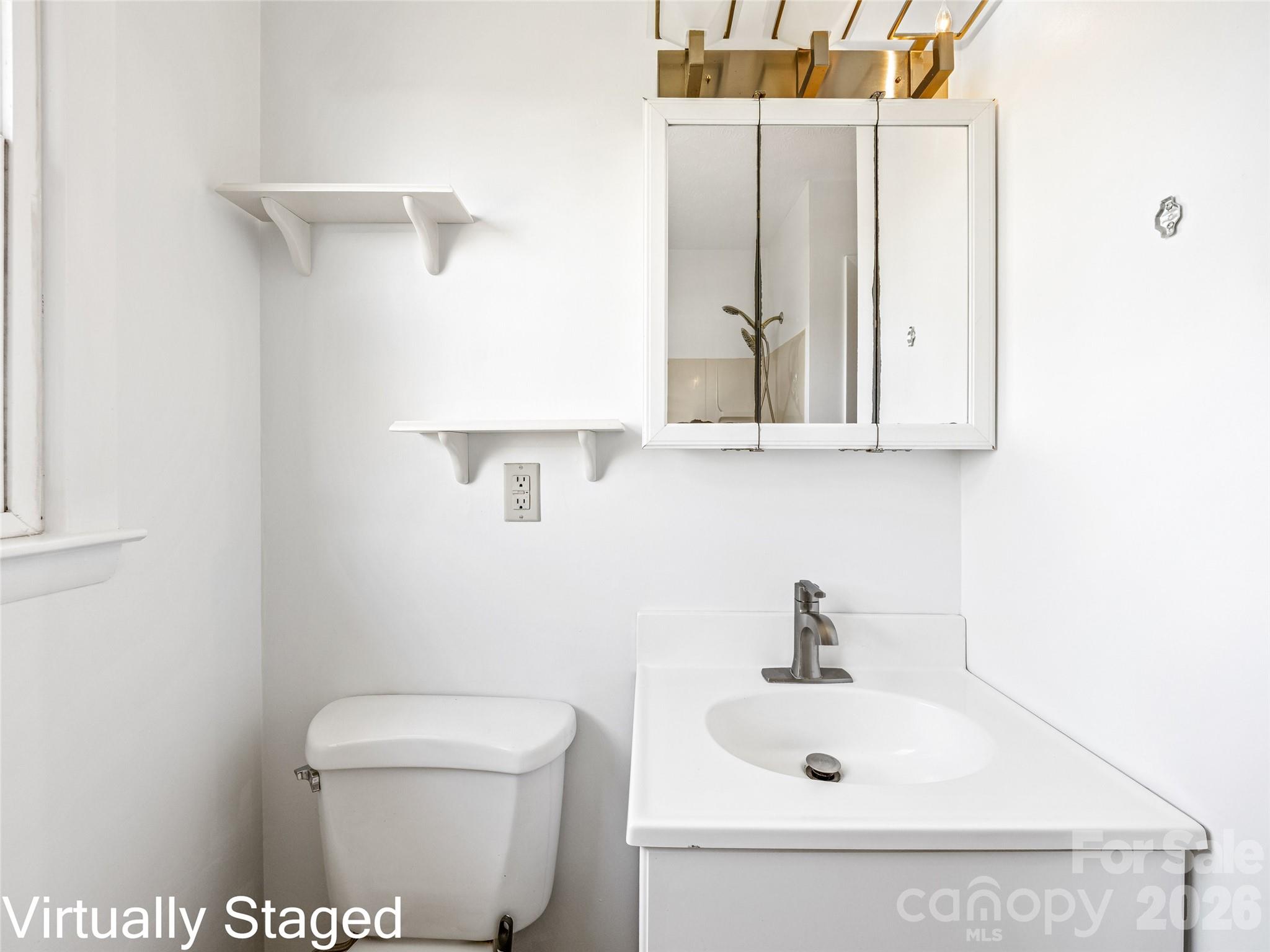 10 Ridge Avenue Asheville, NC 28803 - Photo 17 of 33 a bathroom with a sink a mirror and toilet