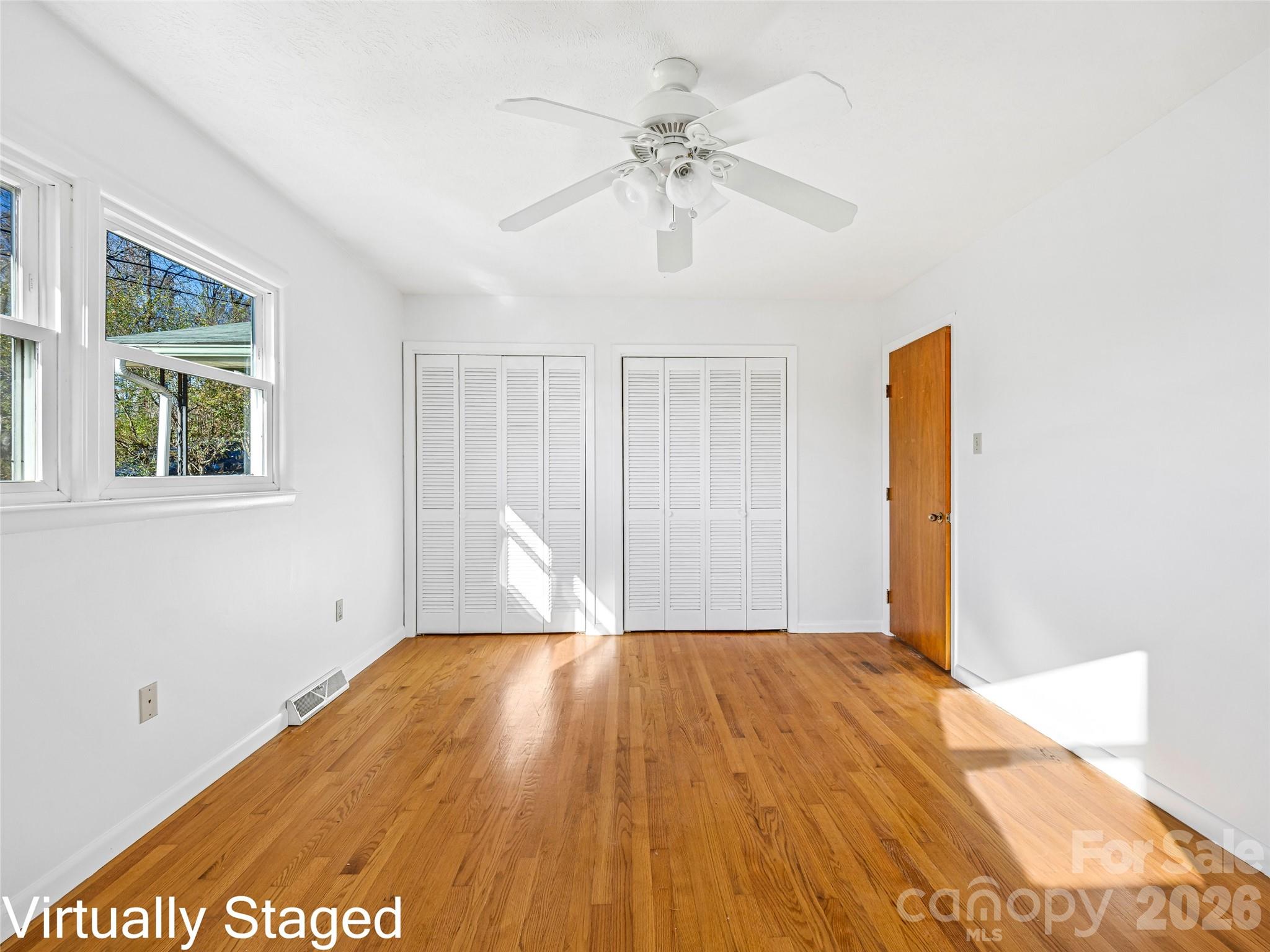 10 Ridge Avenue Asheville, NC 28803 - Photo 19 of 33 a view of empty room with wooden floor and fan