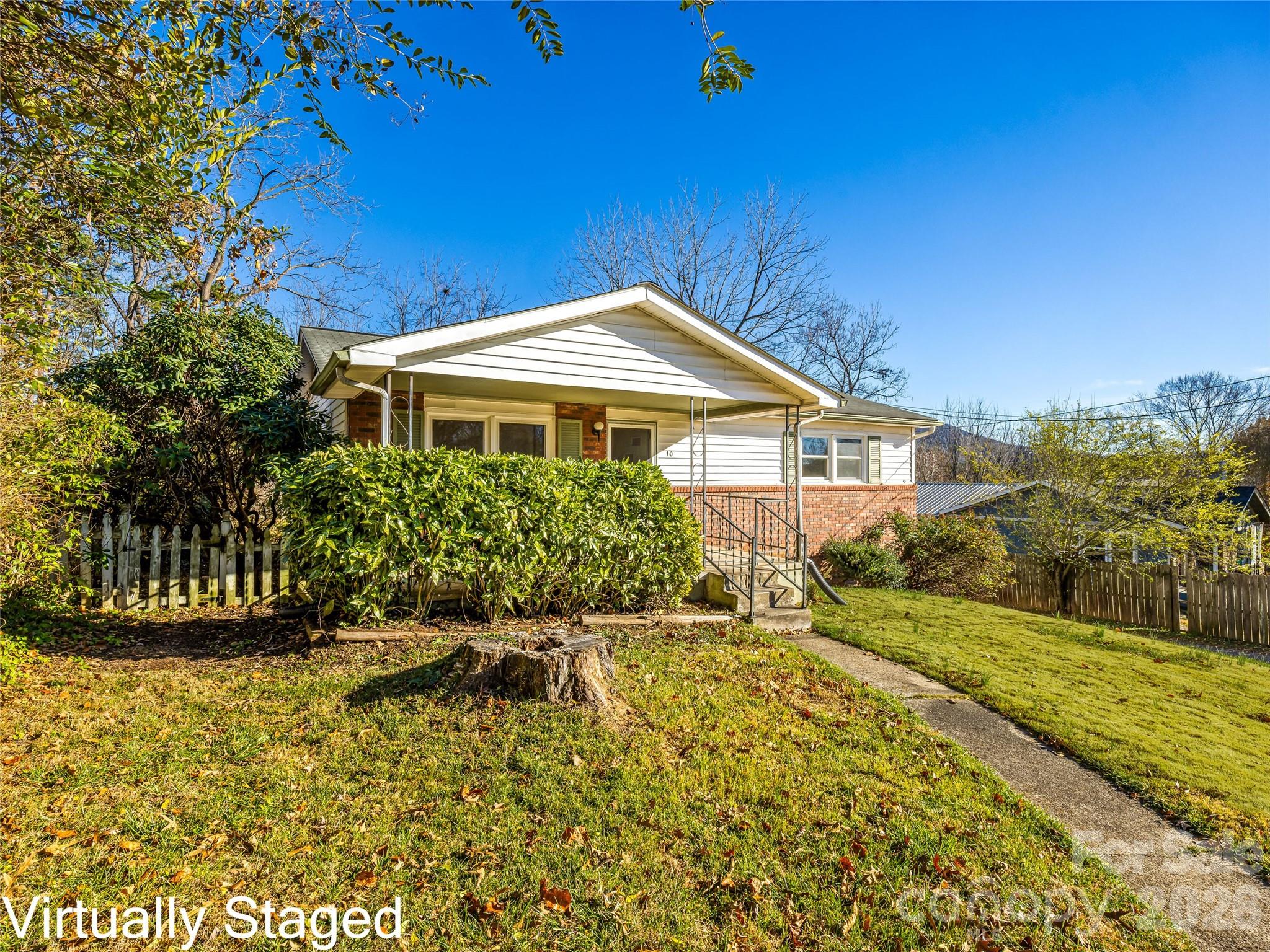 10 Ridge Avenue Asheville, NC 28803 - Photo 5 of 33 a front view of a house with a yard