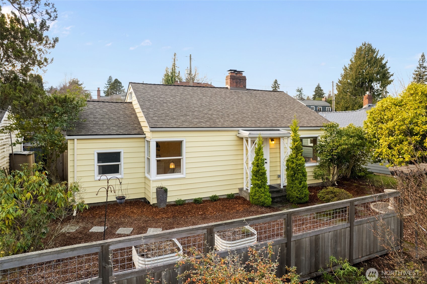 8625 35th Avenue Southwest Seattle, WA 98126 - Photo 1 of 33 a view of a house with a yard and plants