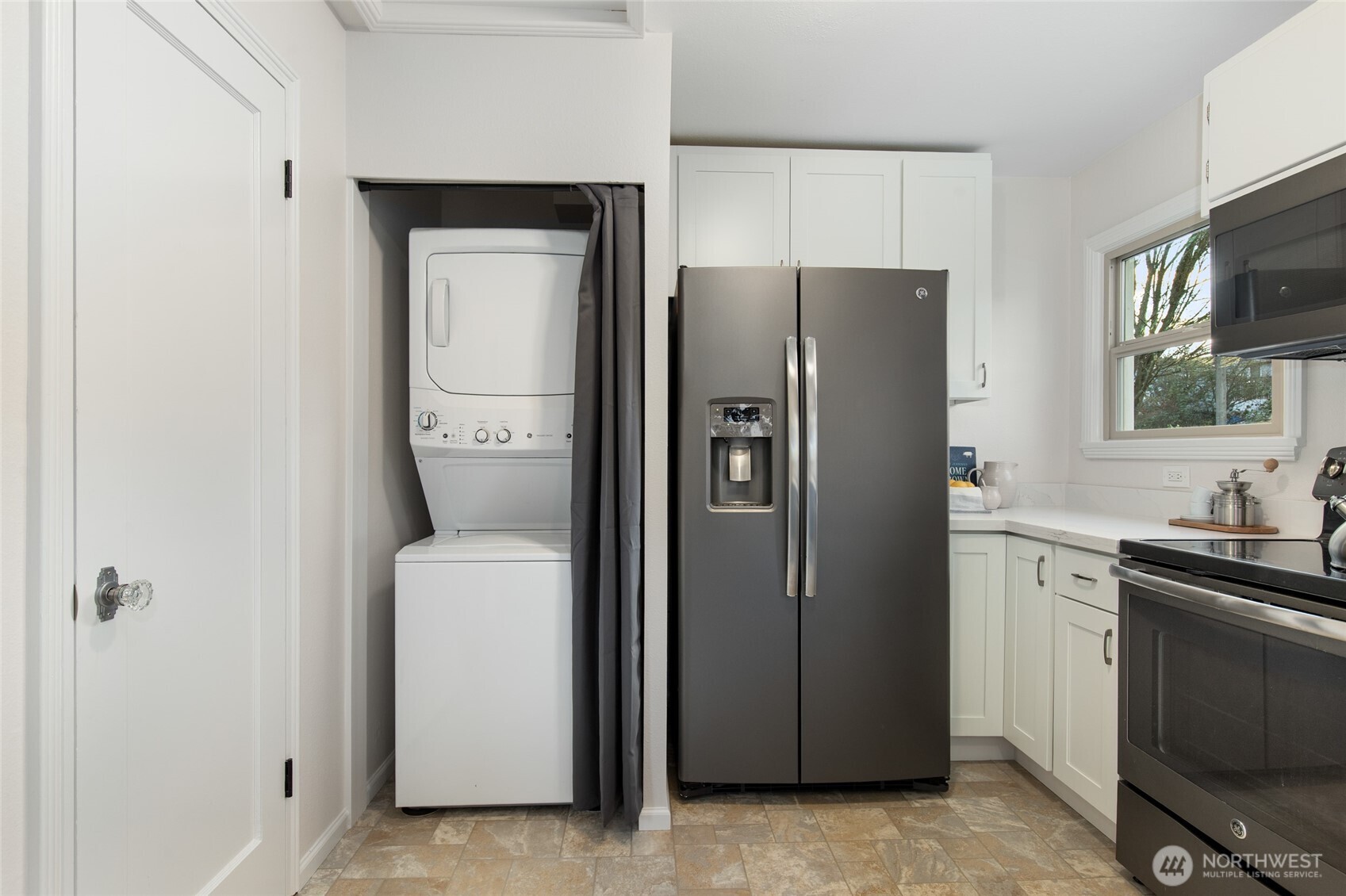 8625 35th Avenue Southwest Seattle, WA 98126 - Photo 11 of 33 a kitchen with a refrigerator sink and stove