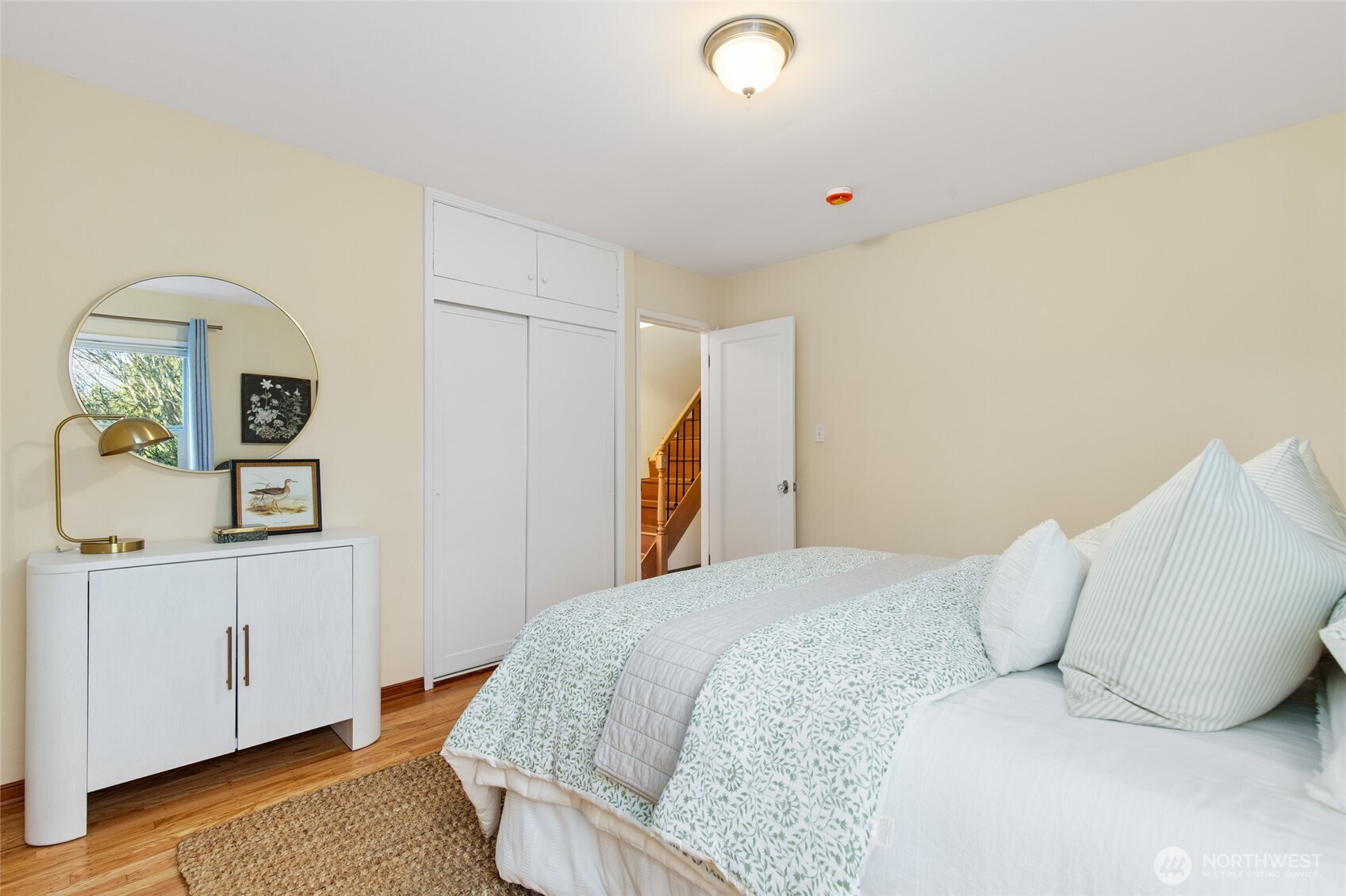 8625 35th Avenue Southwest Seattle, WA 98126 - Photo 13 of 33 a bedroom with a bed and a window