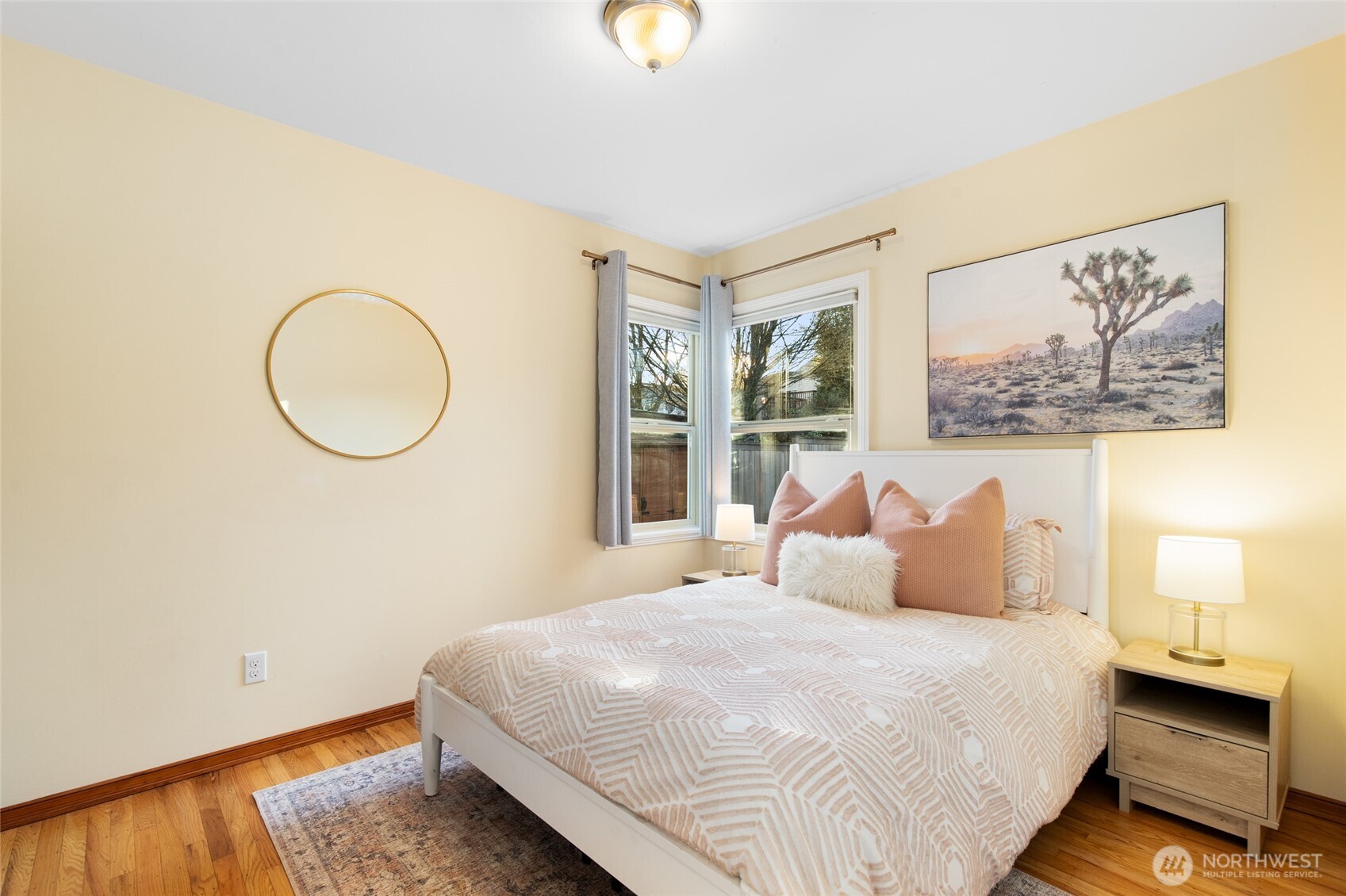 8625 35th Avenue Southwest Seattle, WA 98126 - Photo 15 of 33 a bedroom with a bed and a painting on the wall