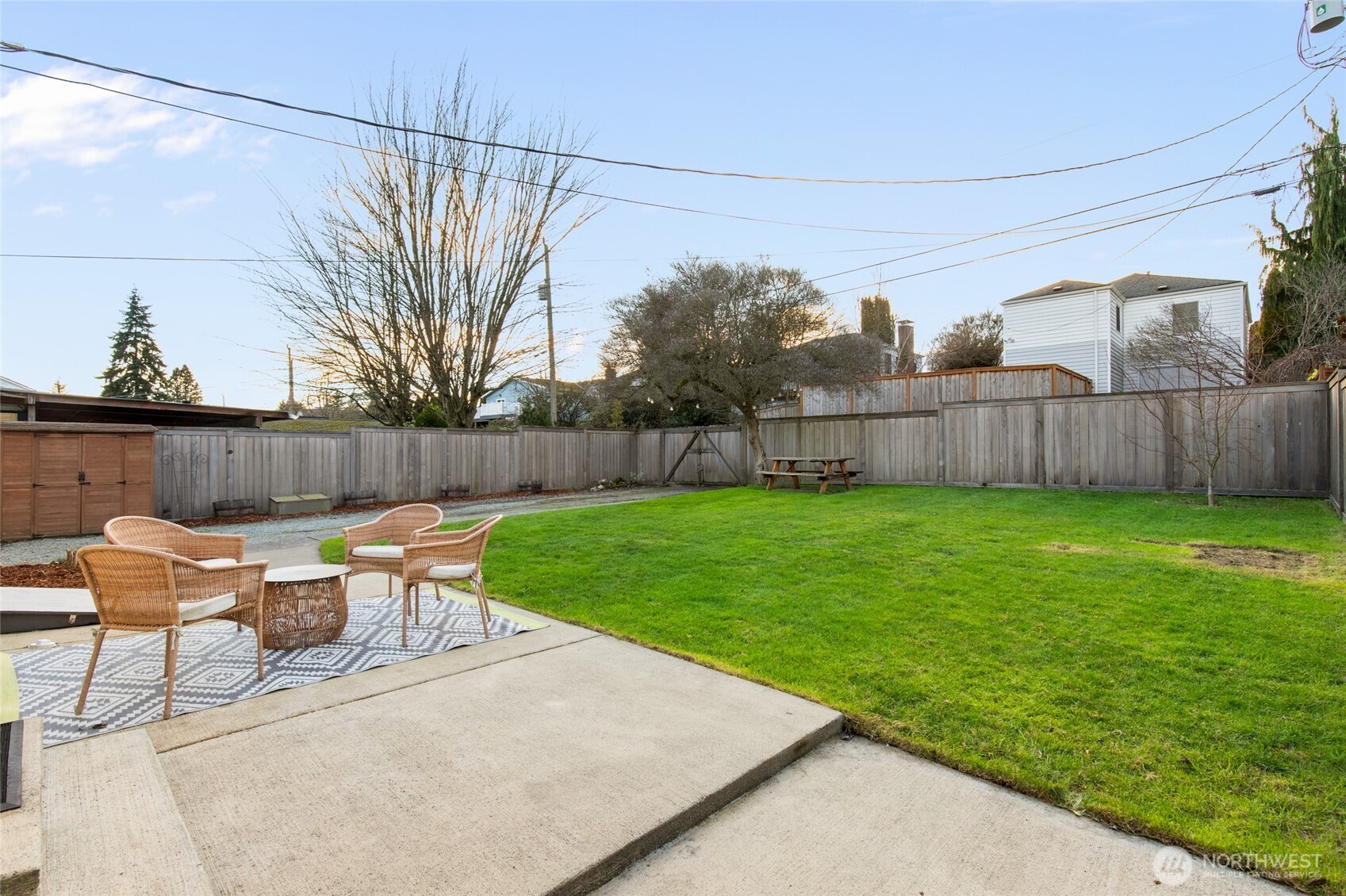 8625 35th Avenue Southwest Seattle, WA 98126 - Photo 22 of 33 a view of yard with seating area and trees in the background