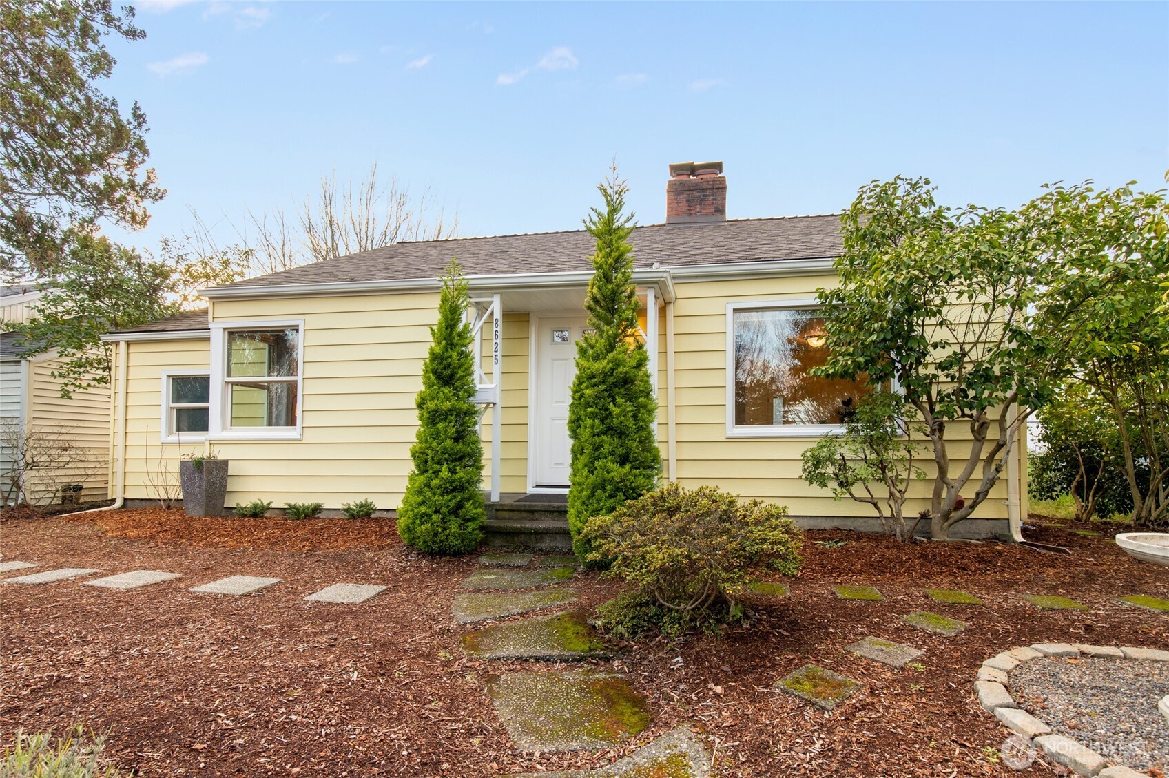 8625 35th Avenue Southwest Seattle, WA 98126 - Photo 32 of 33 a view of a house with a yard