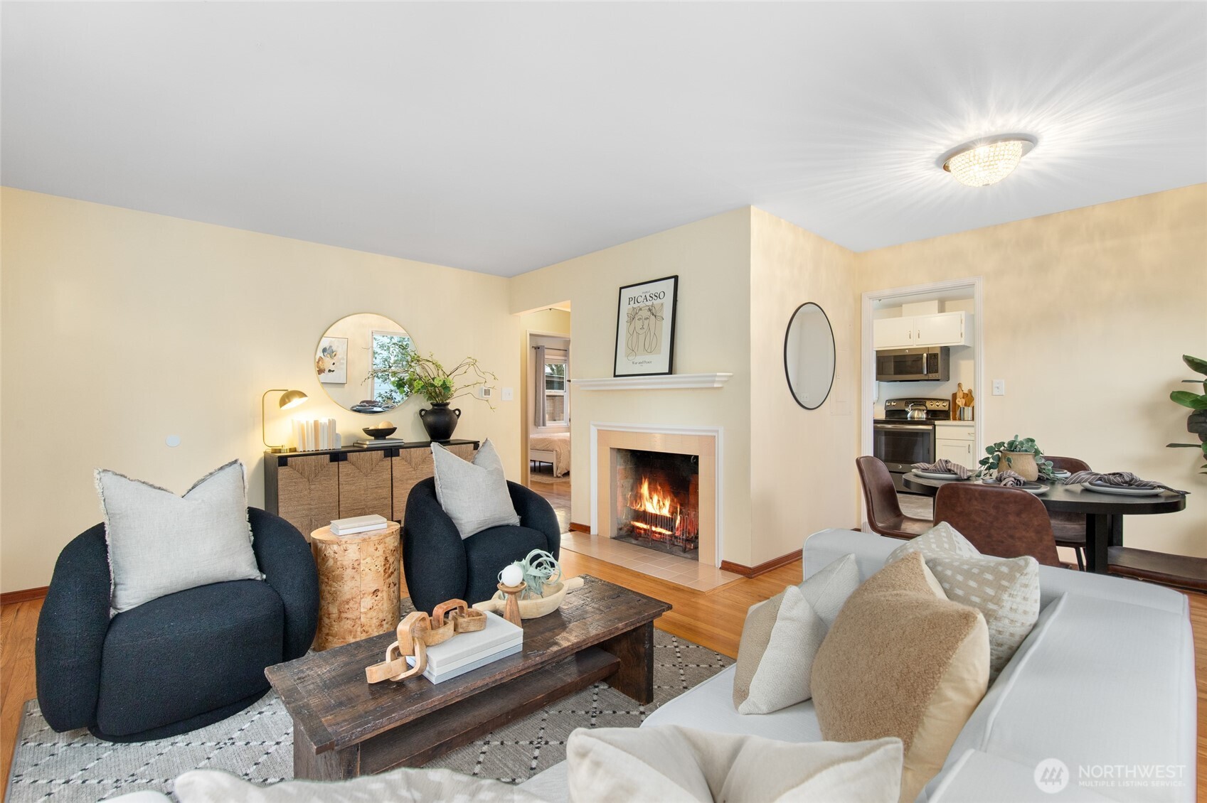 8625 35th Avenue Southwest Seattle, WA 98126 - Photo 5 of 33 a living room with furniture and a fireplace