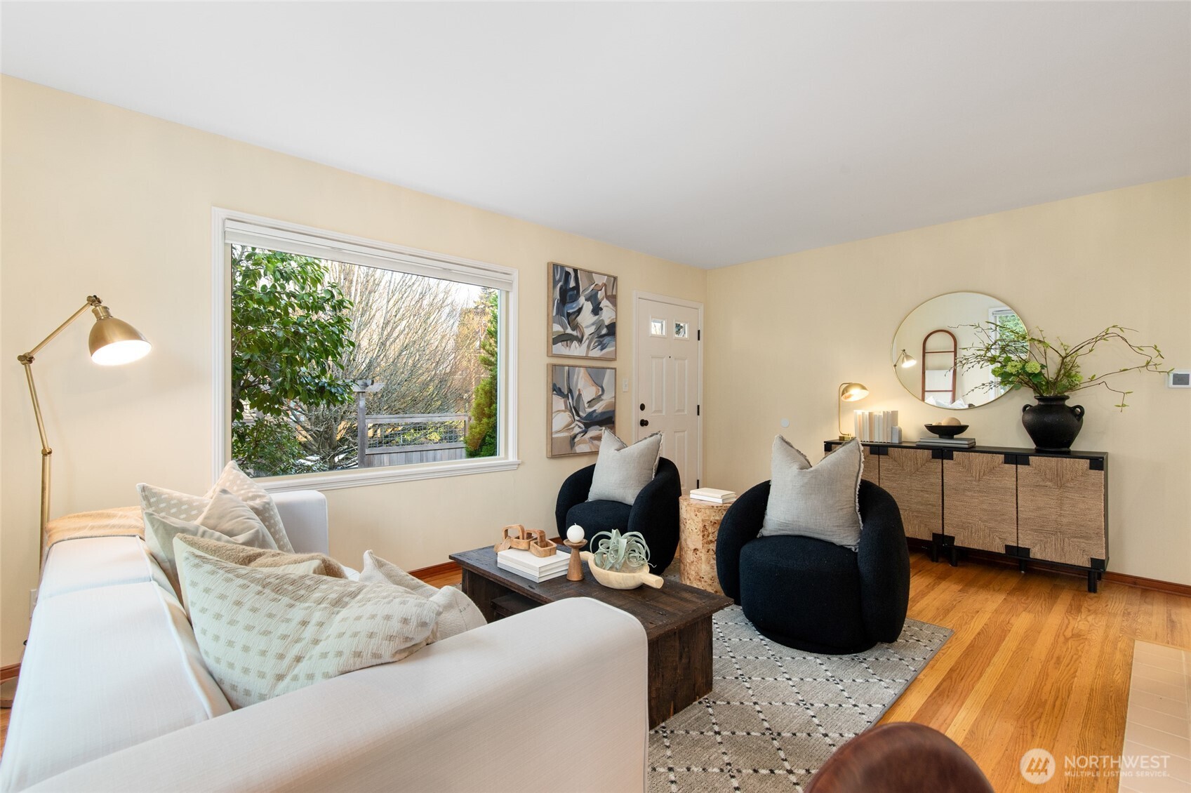 8625 35th Avenue Southwest Seattle, WA 98126 - Photo 6 of 33 a living room with furniture and a large window