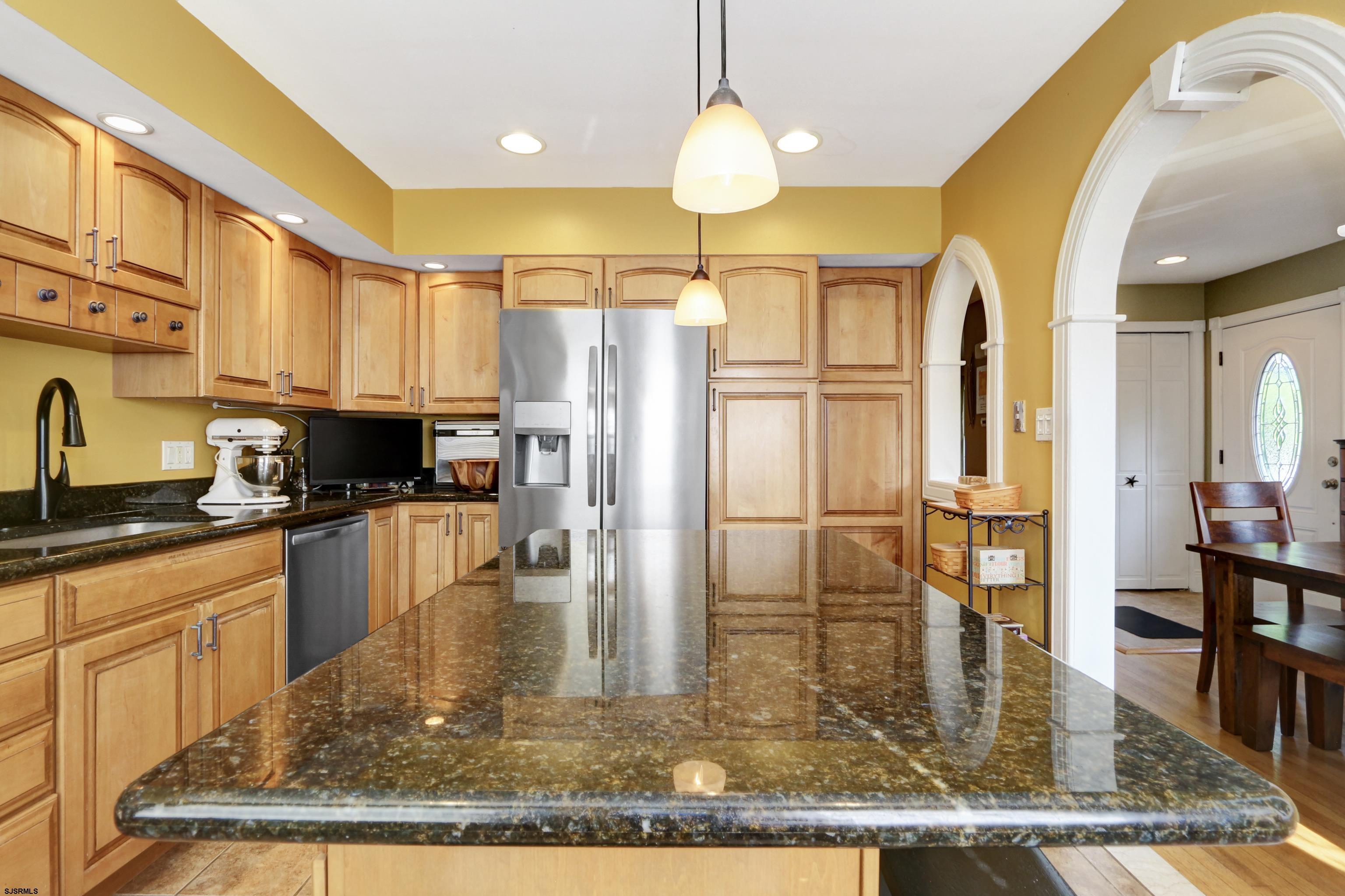 226 Ridgewood Drive Northfield, NJ 08225 - Photo 12 of 41 a kitchen with stainless steel appliances granite countertop a refrigerator a stove and a sink