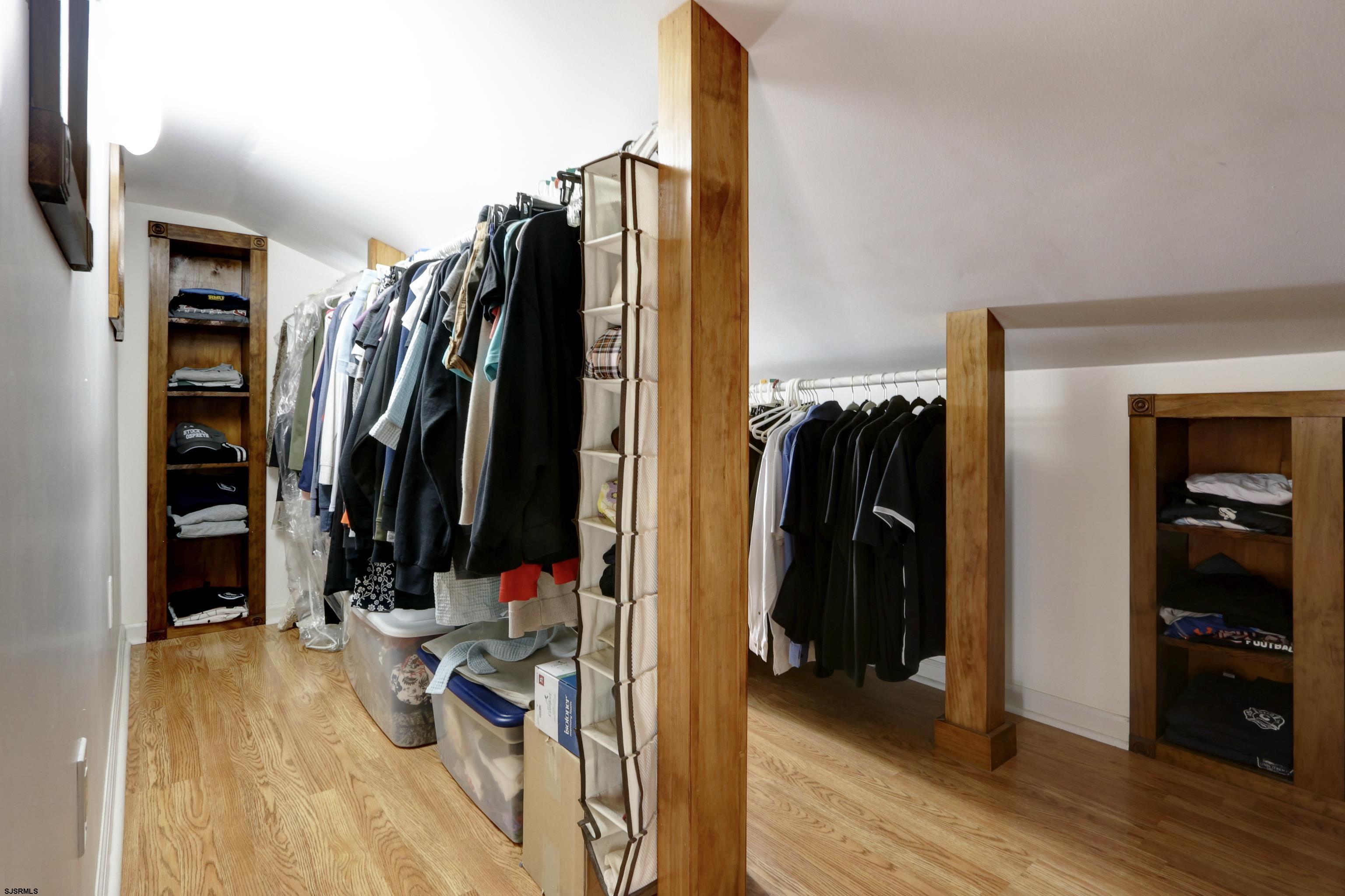 226 Ridgewood Drive Northfield, NJ 08225 - Photo 19 of 41 a view of walk in closet with clothes and shoes