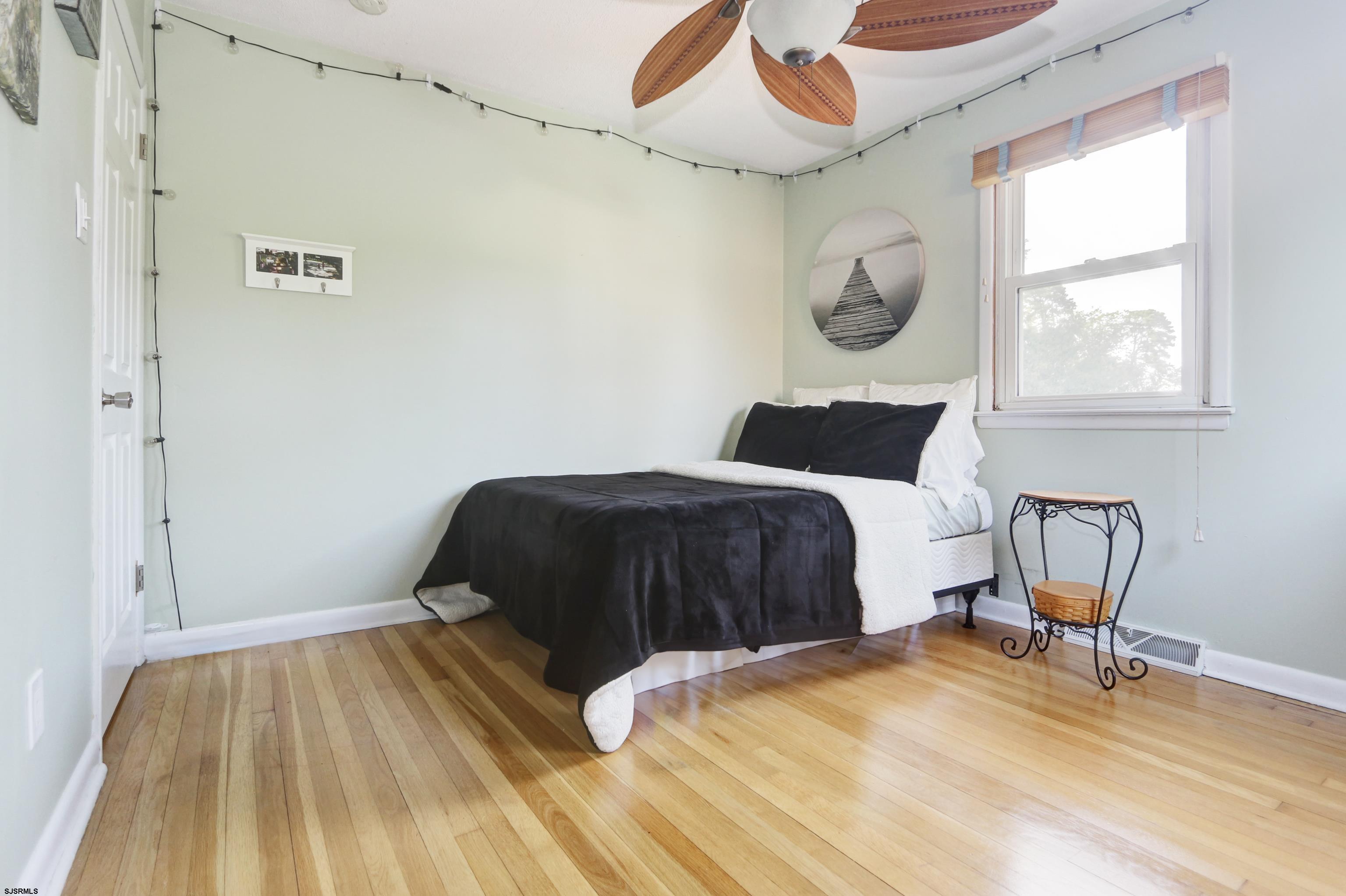 226 Ridgewood Drive Northfield, NJ 08225 - Photo 20 of 41 a bedroom with a bed and a window