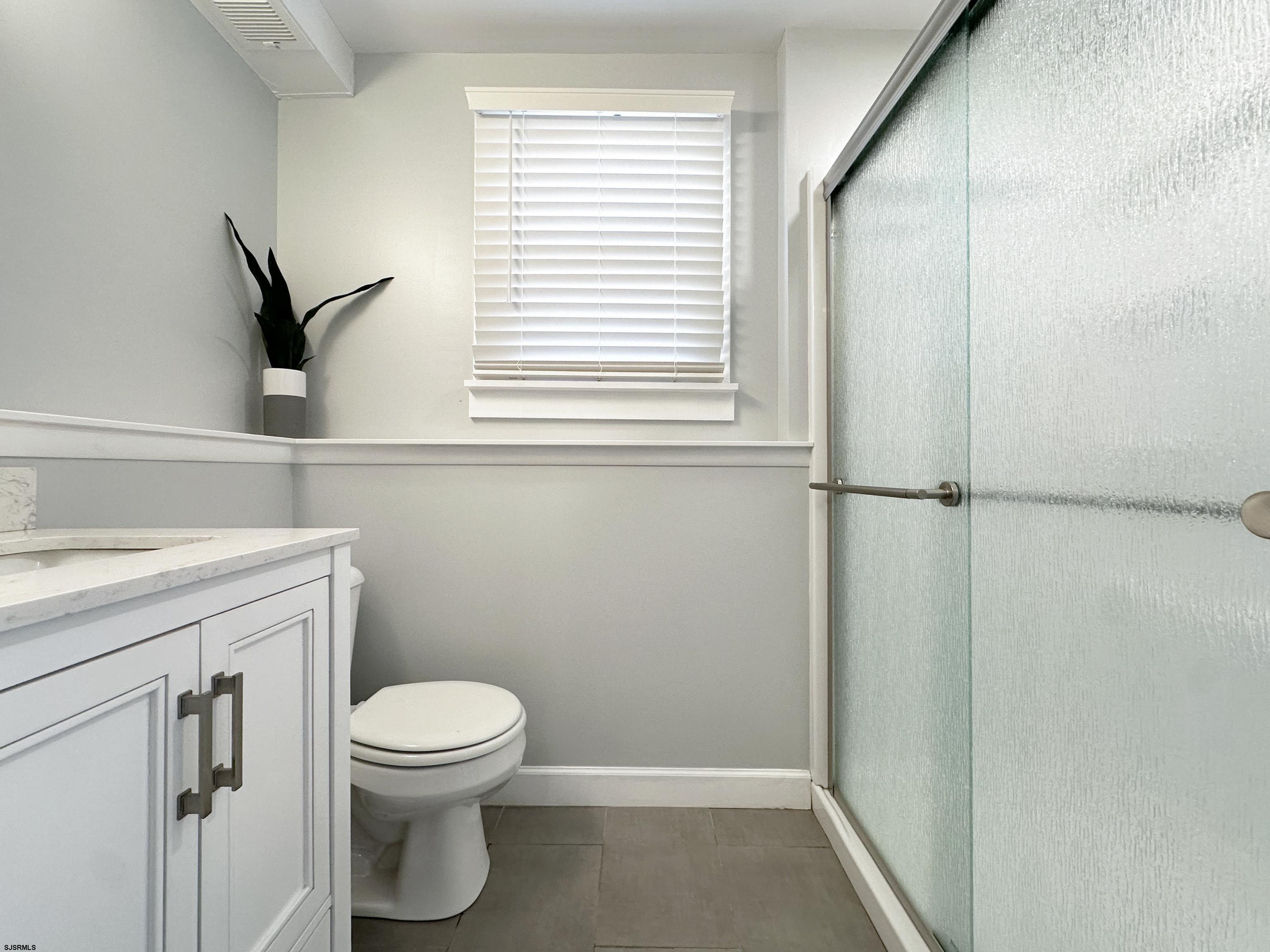 226 Ridgewood Drive Northfield, NJ 08225 - Photo 23 of 41 a bathroom with a toilet and a sink