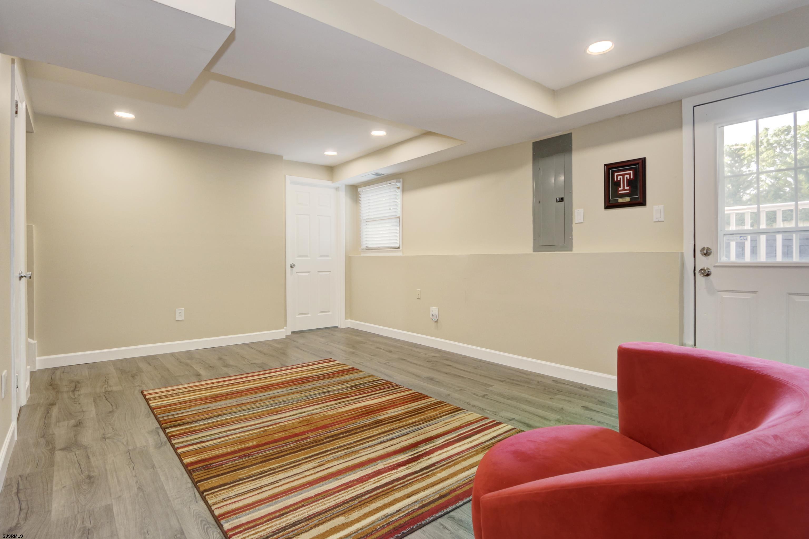 226 Ridgewood Drive Northfield, NJ 08225 - Photo 24 of 41 a bedroom with furniture and wooden floor