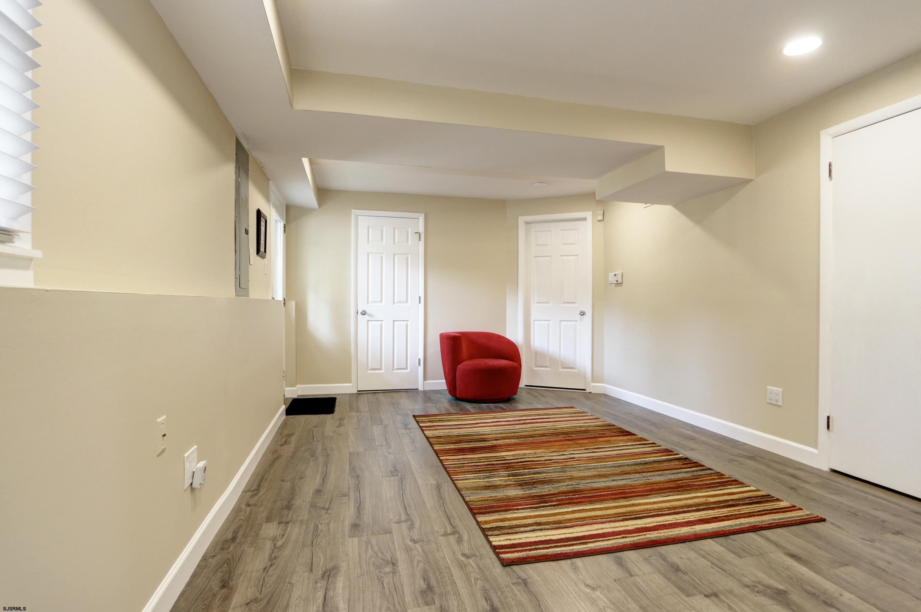 226 Ridgewood Drive Northfield, NJ 08225 - Photo 25 of 41 a view of a room with wooden floor and cabinet