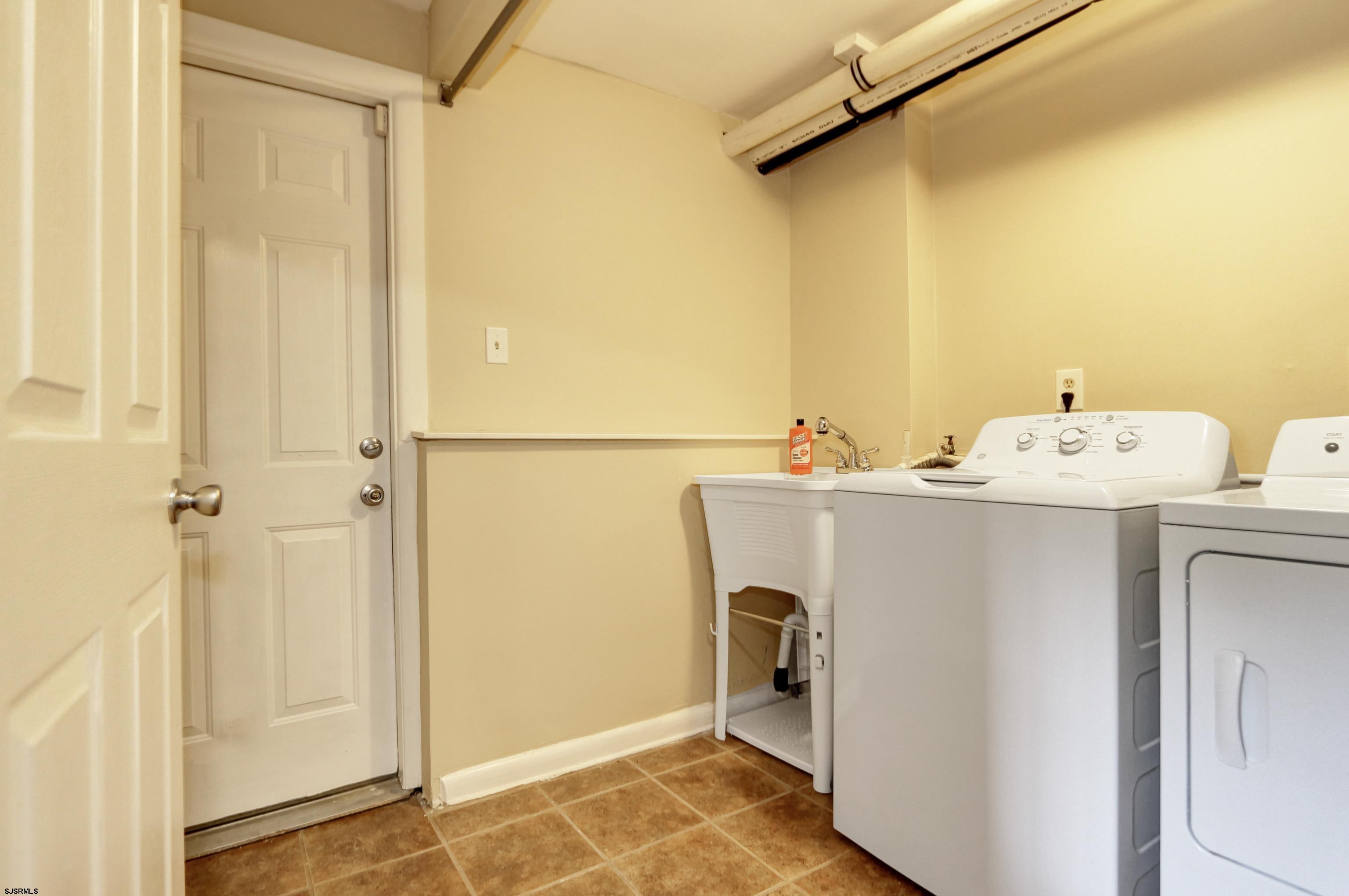 226 Ridgewood Drive Northfield, NJ 08225 - Photo 26 of 41 a utility room with dryer and washer