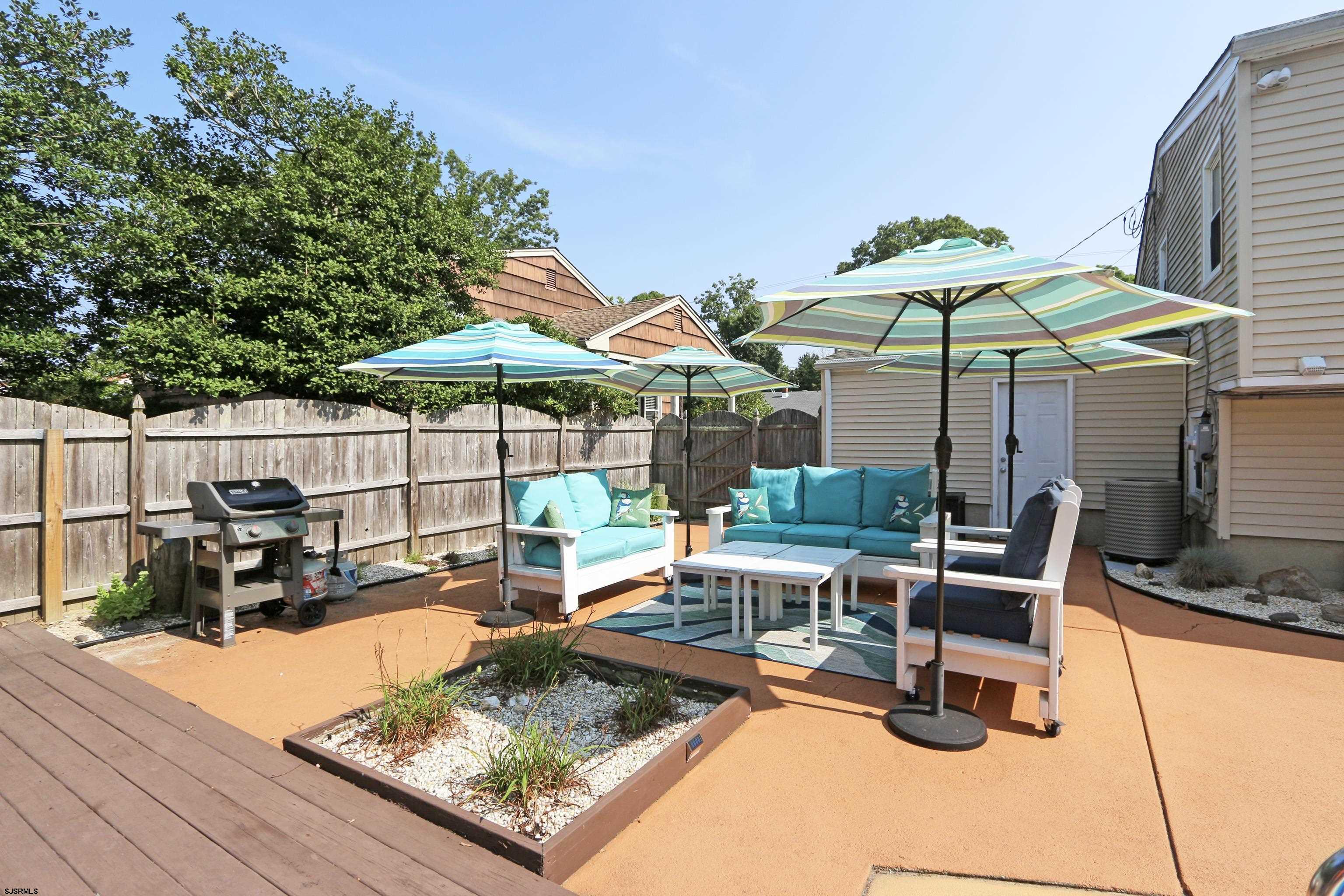 226 Ridgewood Drive Northfield, NJ 08225 - Photo 29 of 41 a view of a backyard with sitting area and furniture