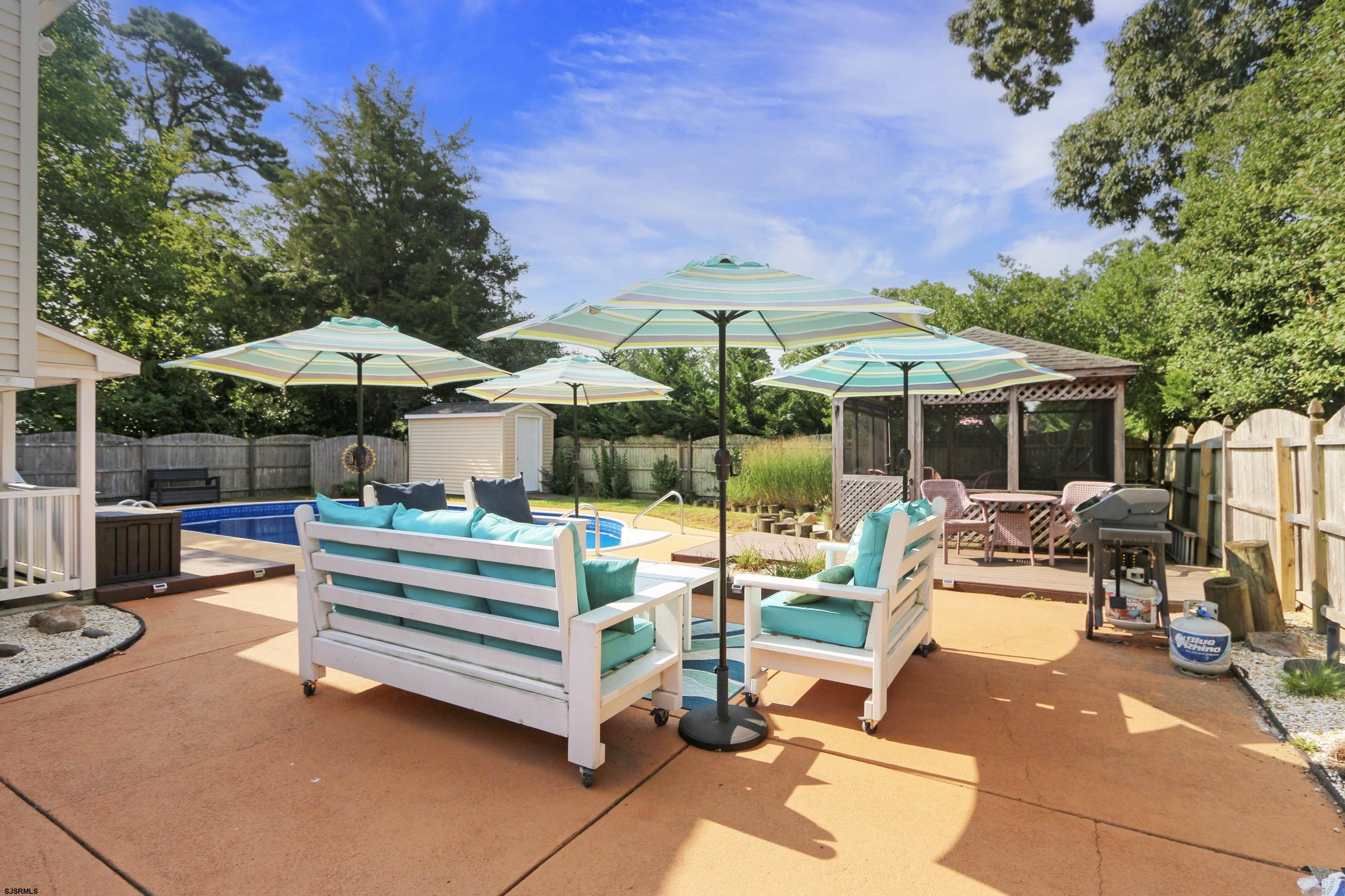 226 Ridgewood Drive Northfield, NJ 08225 - Photo 31 of 41 a view of backyard with outdoor seating and trees